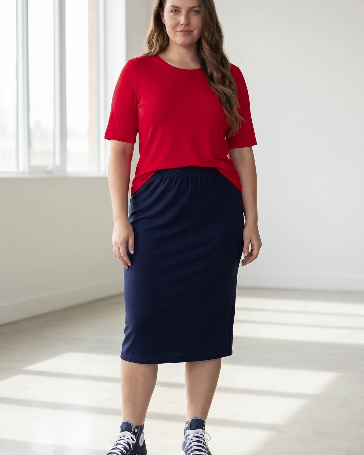 Model wearing the Nuggles® Essential Half Sleeve Tee in Red