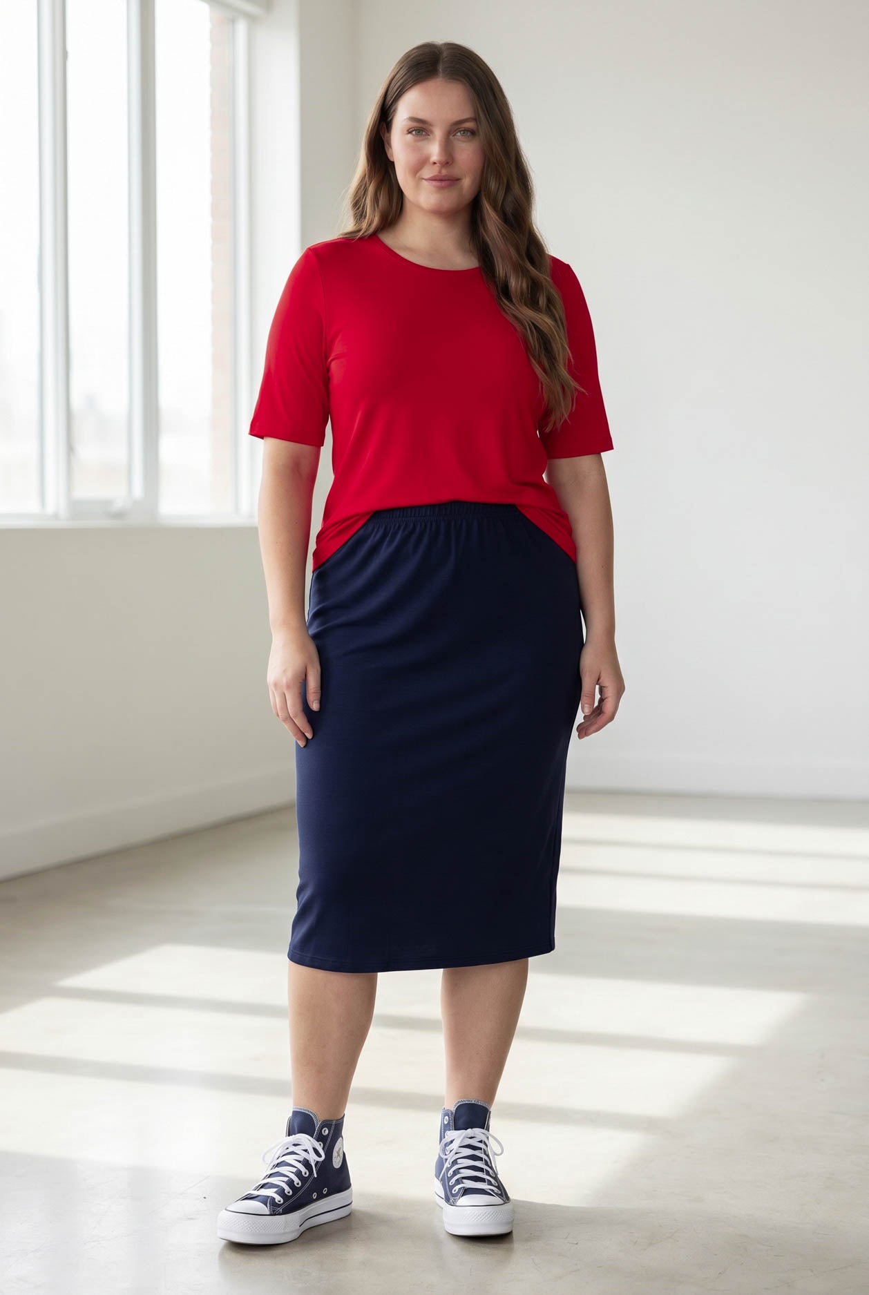 Model wearing the Nuggles® Essential Half Sleeve Tee in Red