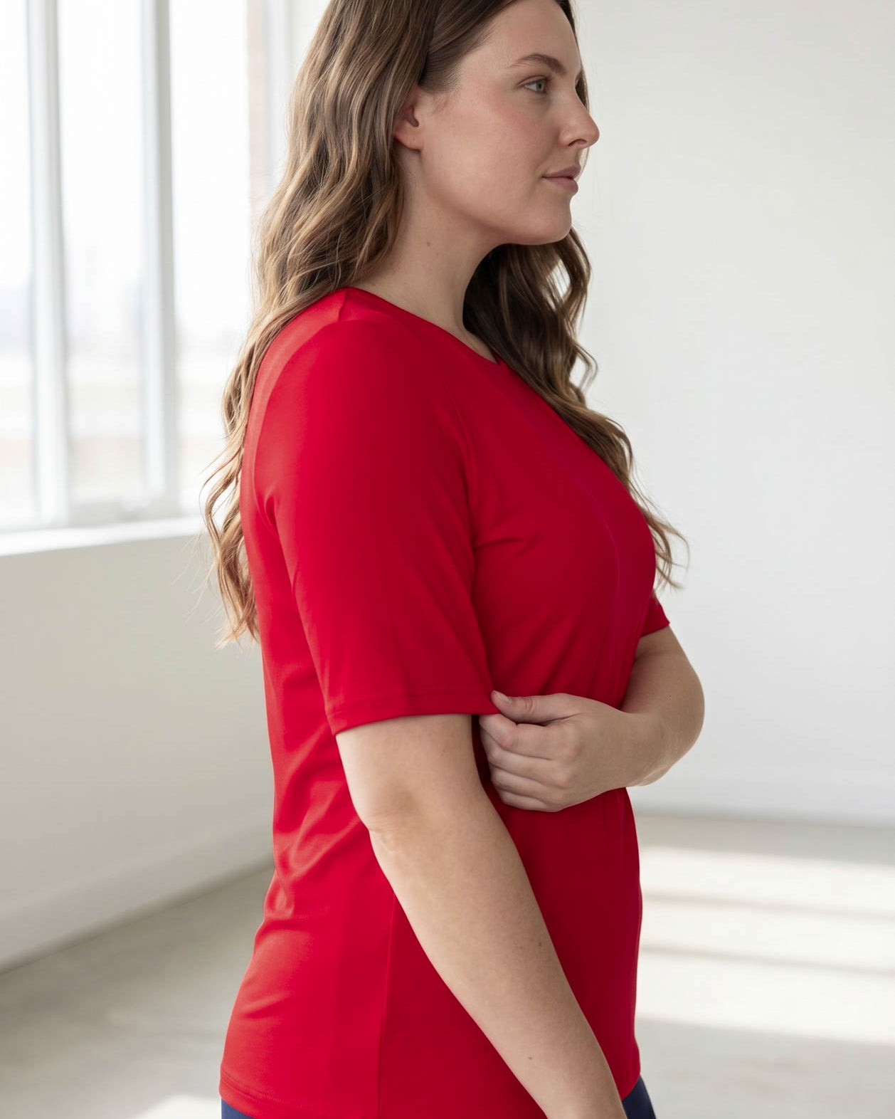 Model wearing the Nuggles® Essential Half Sleeve Tee in Red