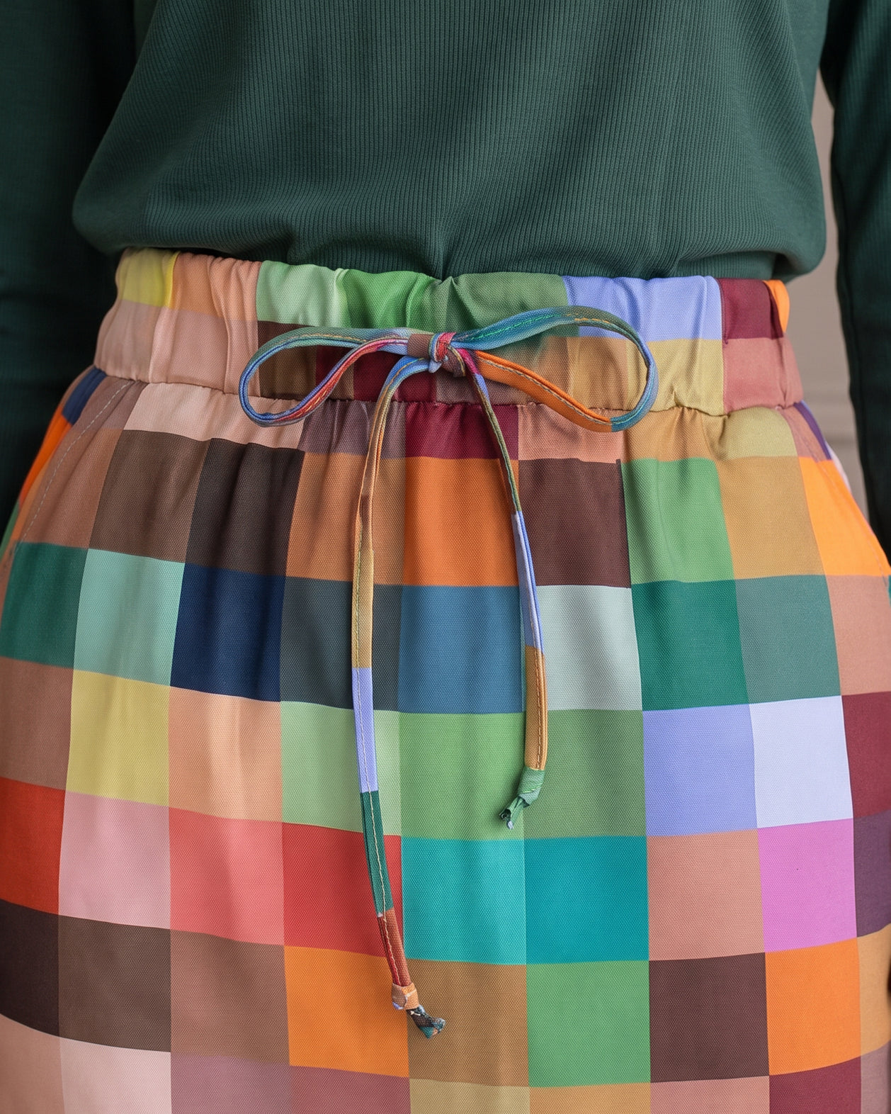 Model wearing Nuggles® 31" Drawstring Skirt in Retro Mosaic