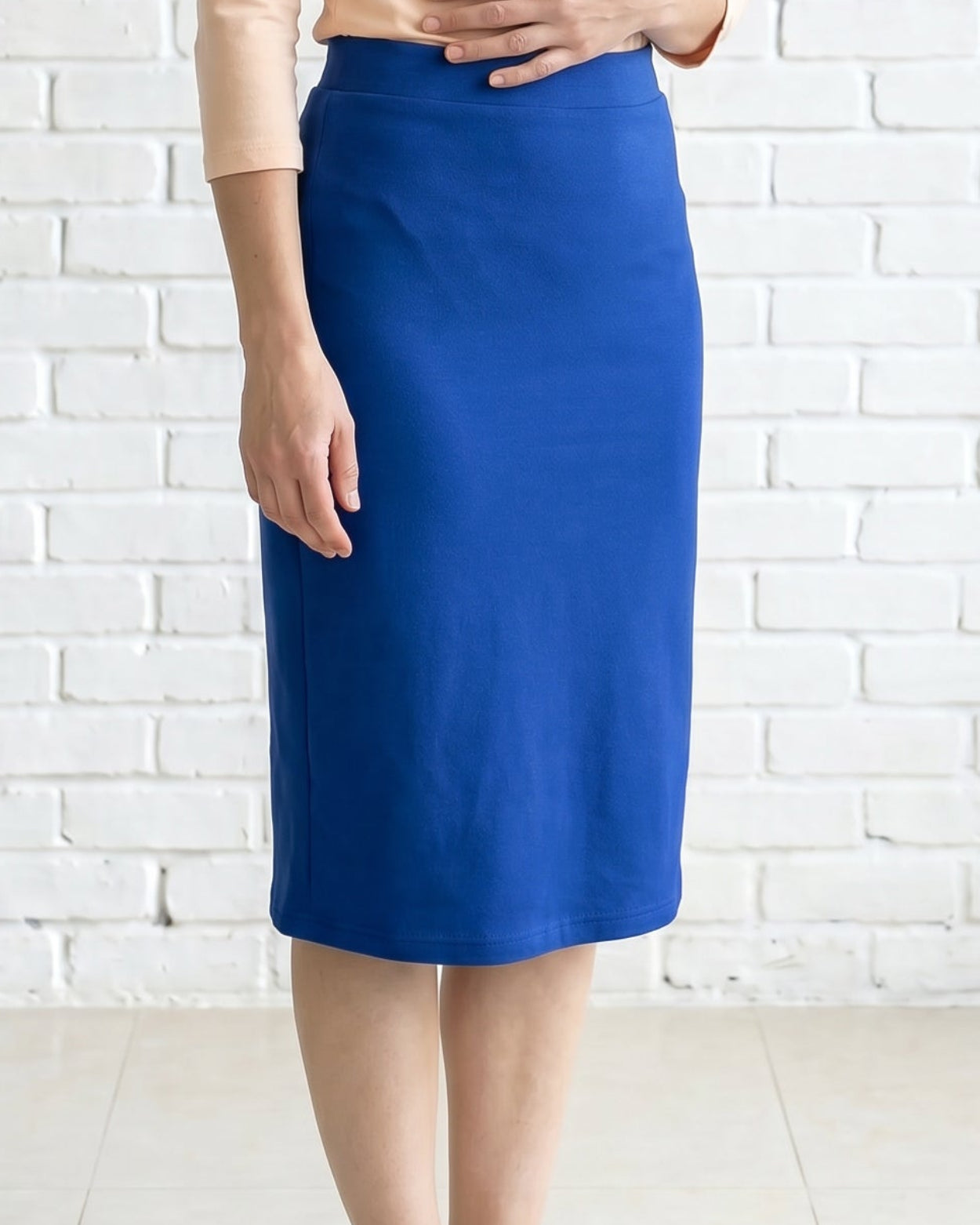 Model wearing Nuggles® 27" Relaxed Skirt in Royal Blue