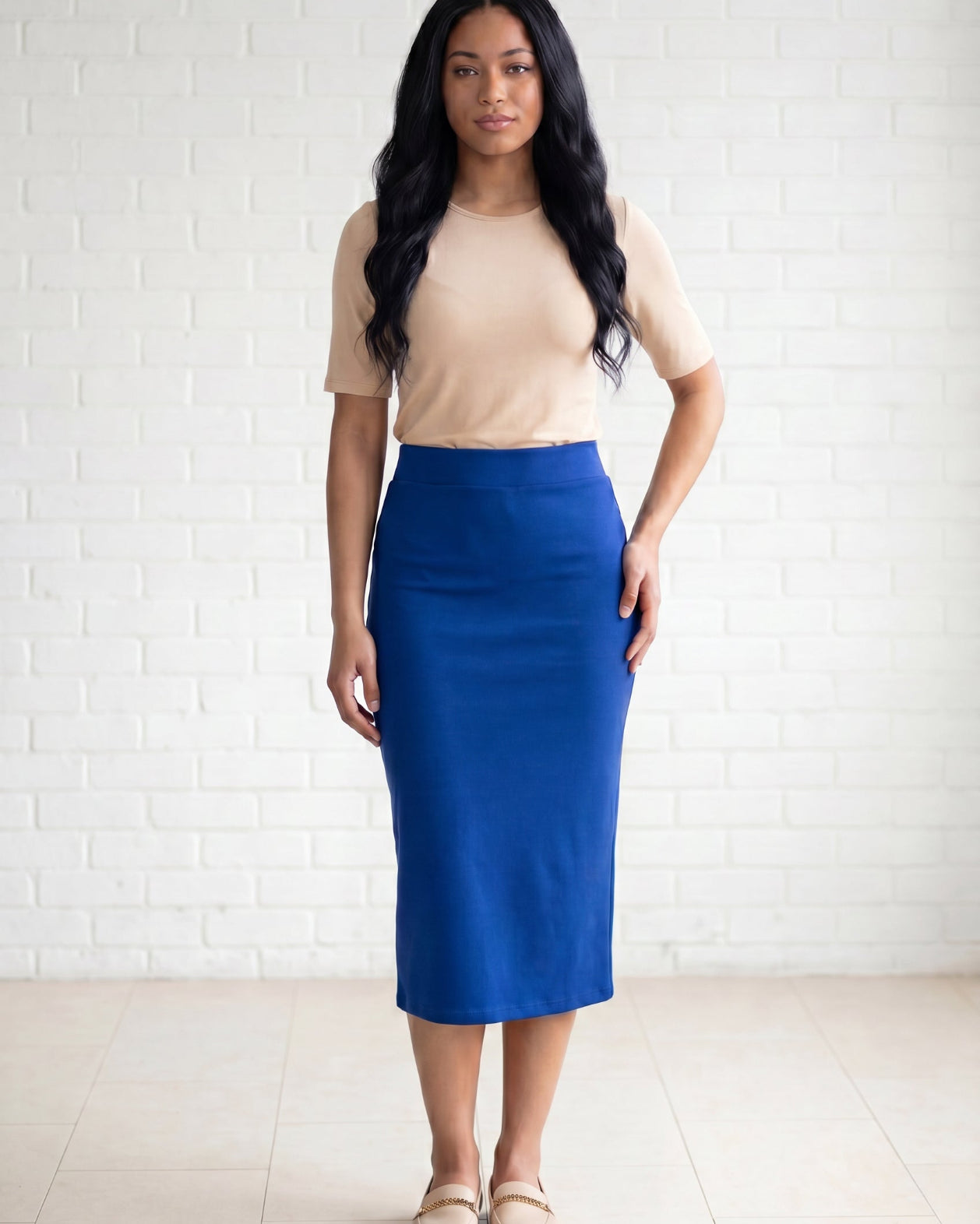 Model wearing Nuggles® 31" Relaxed Skirt in Royal Blue
