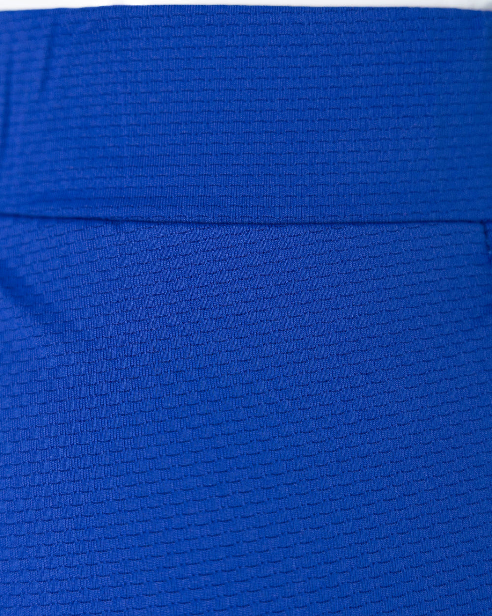 Model wearing Nuggles® 31" All-Sport Skirt in Royal Blue