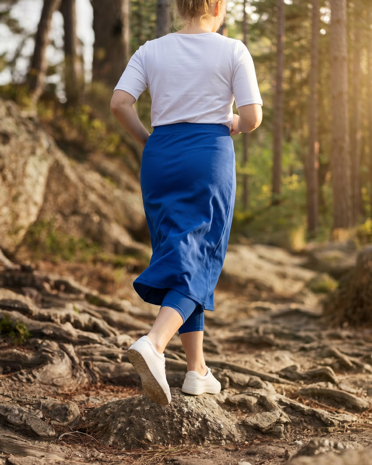 Model wearing Nuggles® 31" All-Sport Skirt in Royal Blue