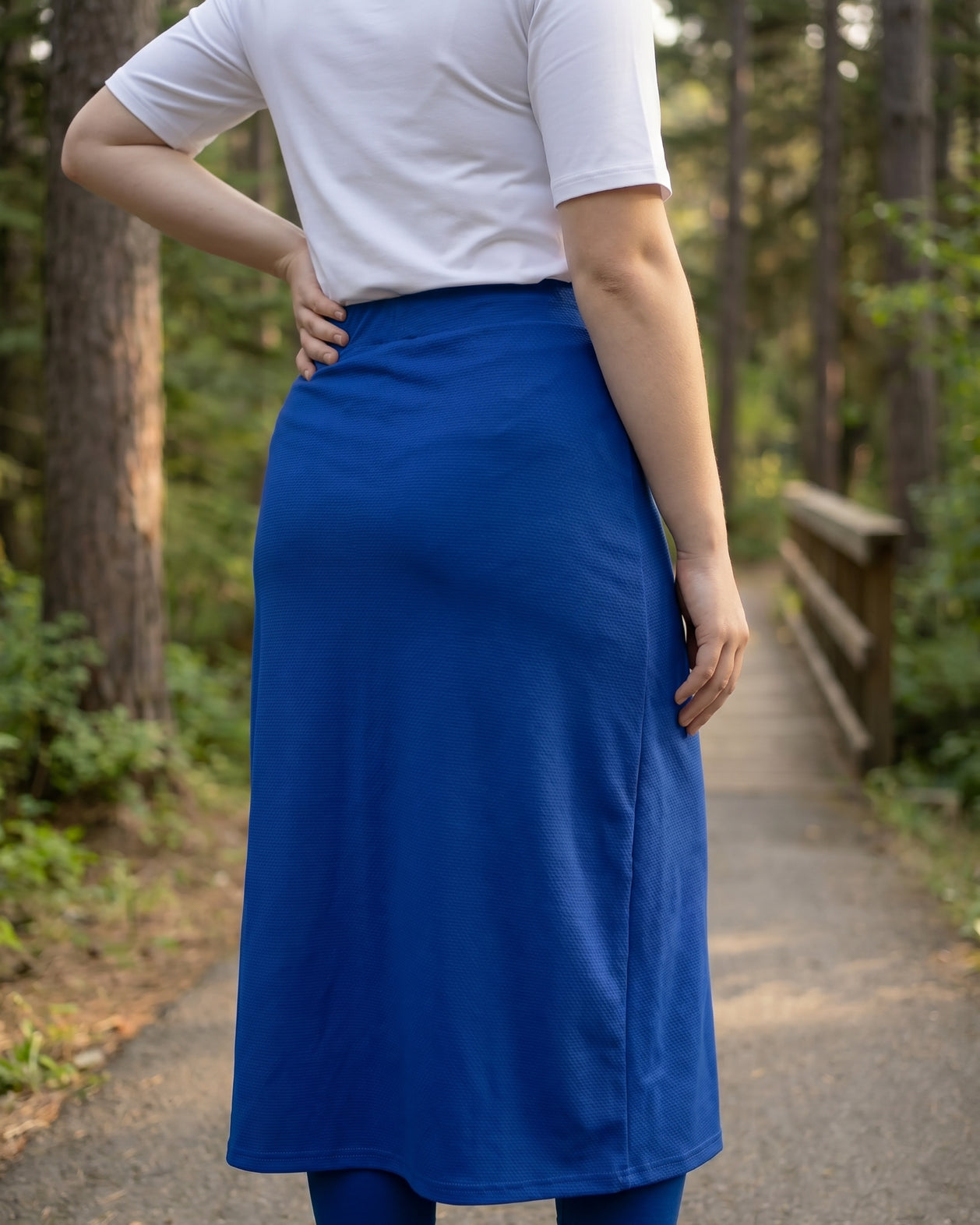 Model wearing Nuggles® 31" All-Sport Skirt in Royal Blue