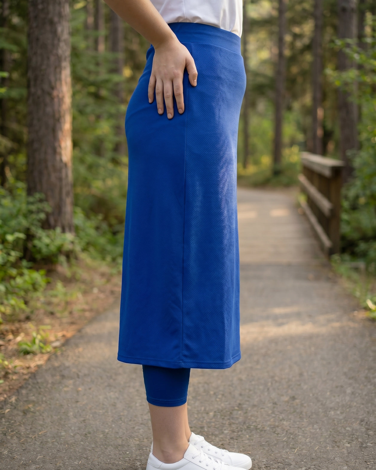 Model wearing Nuggles® 31" All-Sport Skirt in Royal Blue