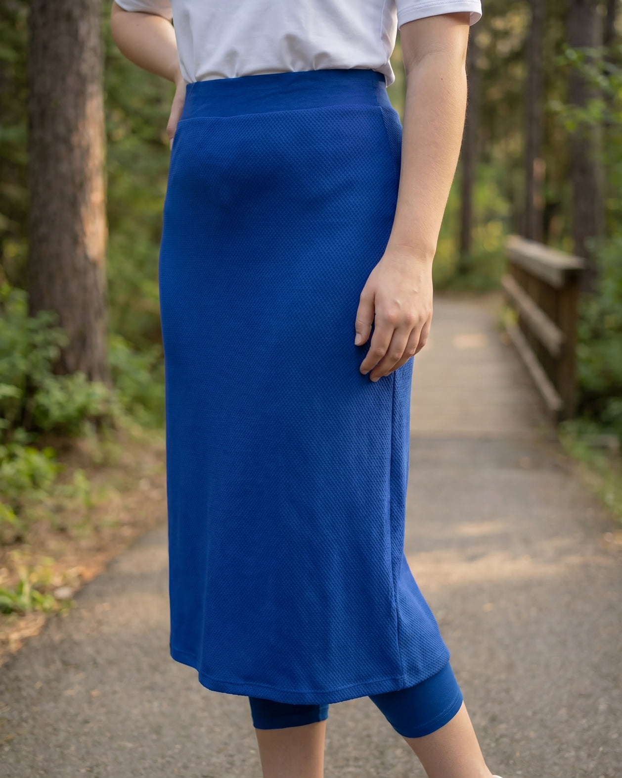 Model wearing Nuggles® 31" All-Sport Skirt in Royal Blue