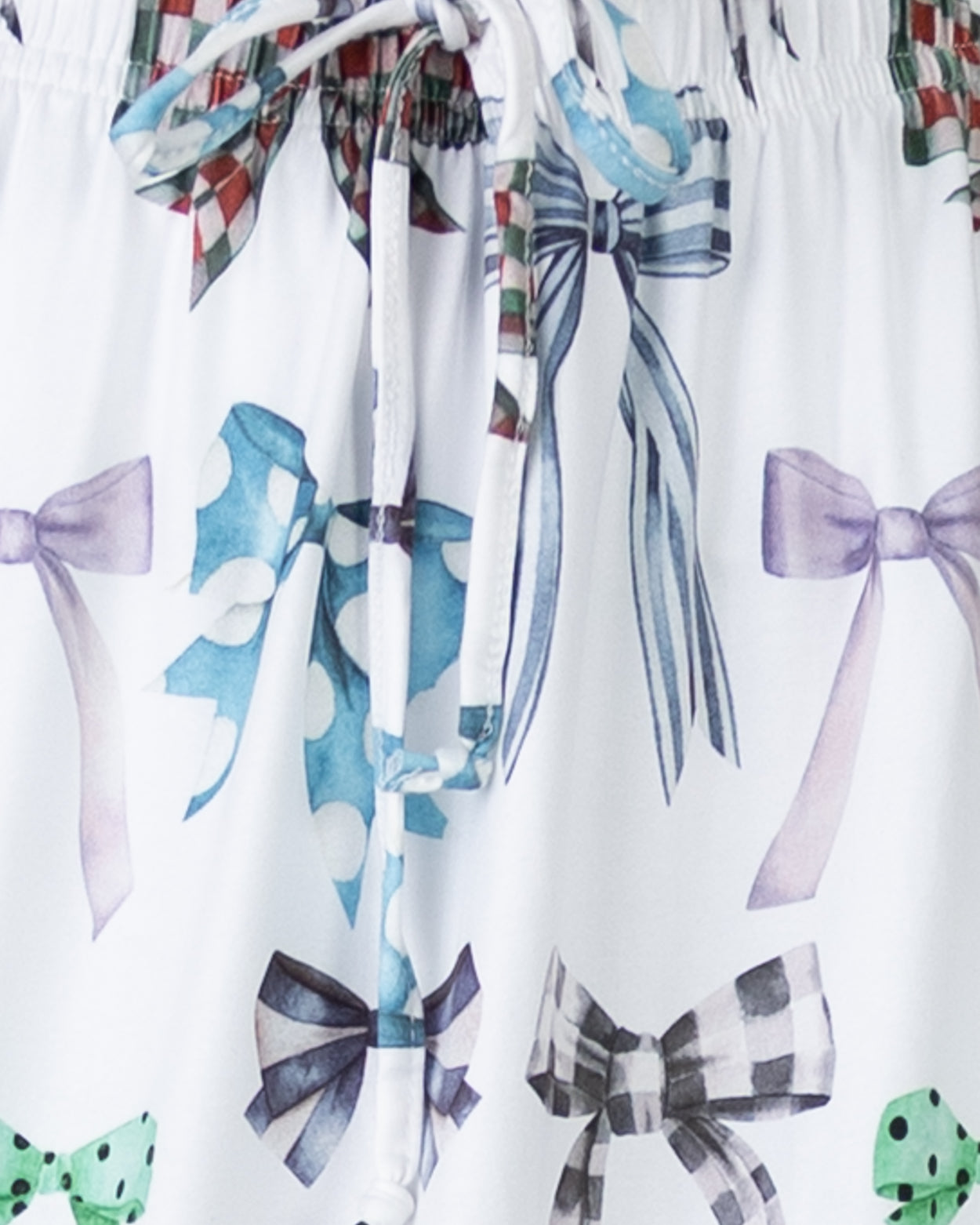 White fabric with colorful bow patterns