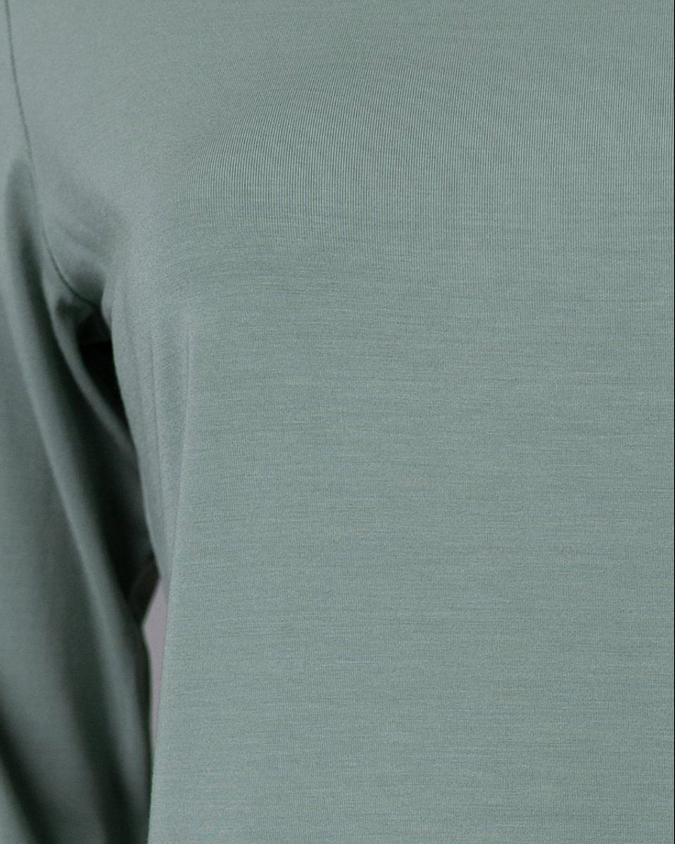Model wearing Nuggles® 3/4 Essential Tee in Seafoam Green