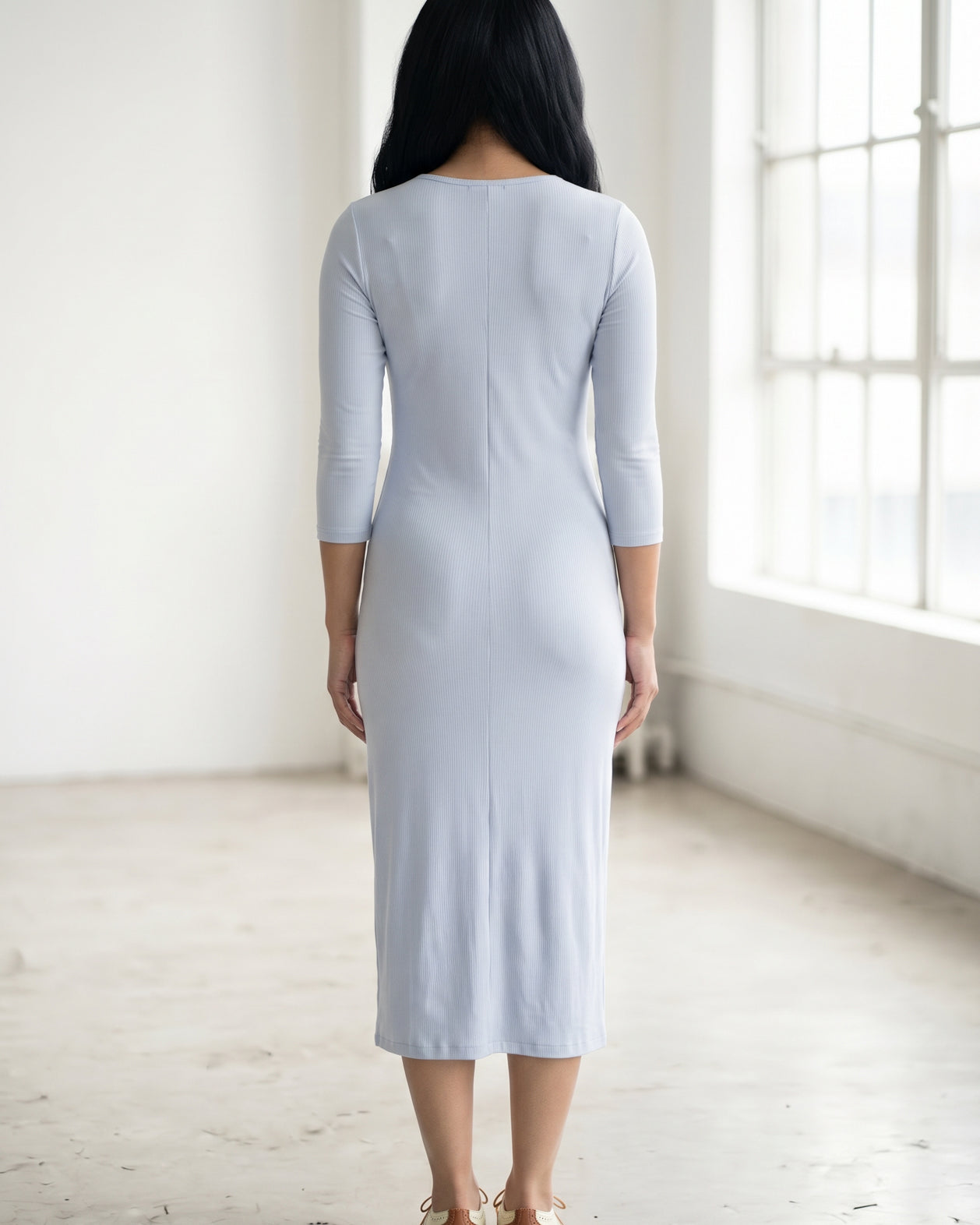 Model wearing Nuggles® Ribbed Midi Layering Dress in Soft Blue