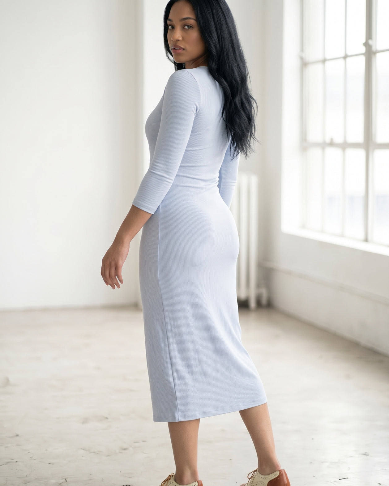 Model wearing Nuggles® Ribbed Midi Layering Dress in Soft Blue