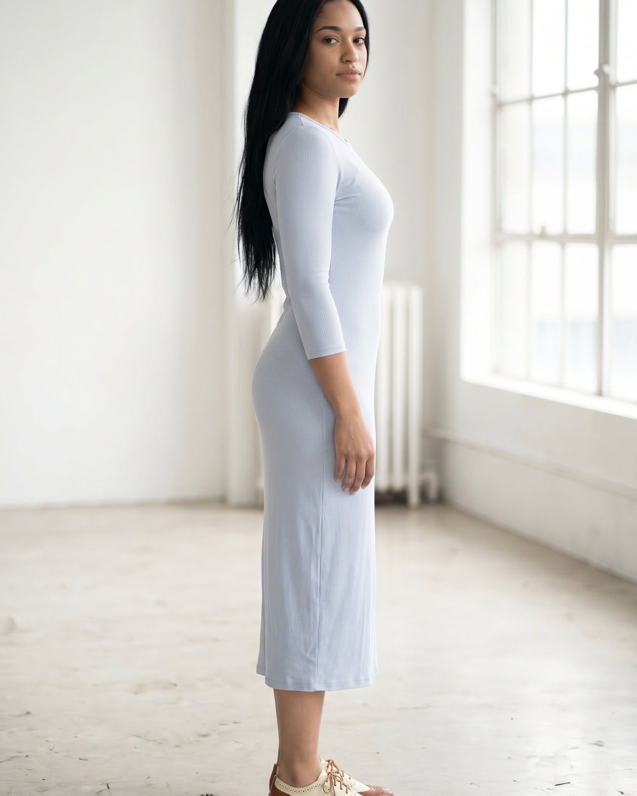 Model wearing Nuggles® Ribbed Midi Layering Dress in Soft Blue