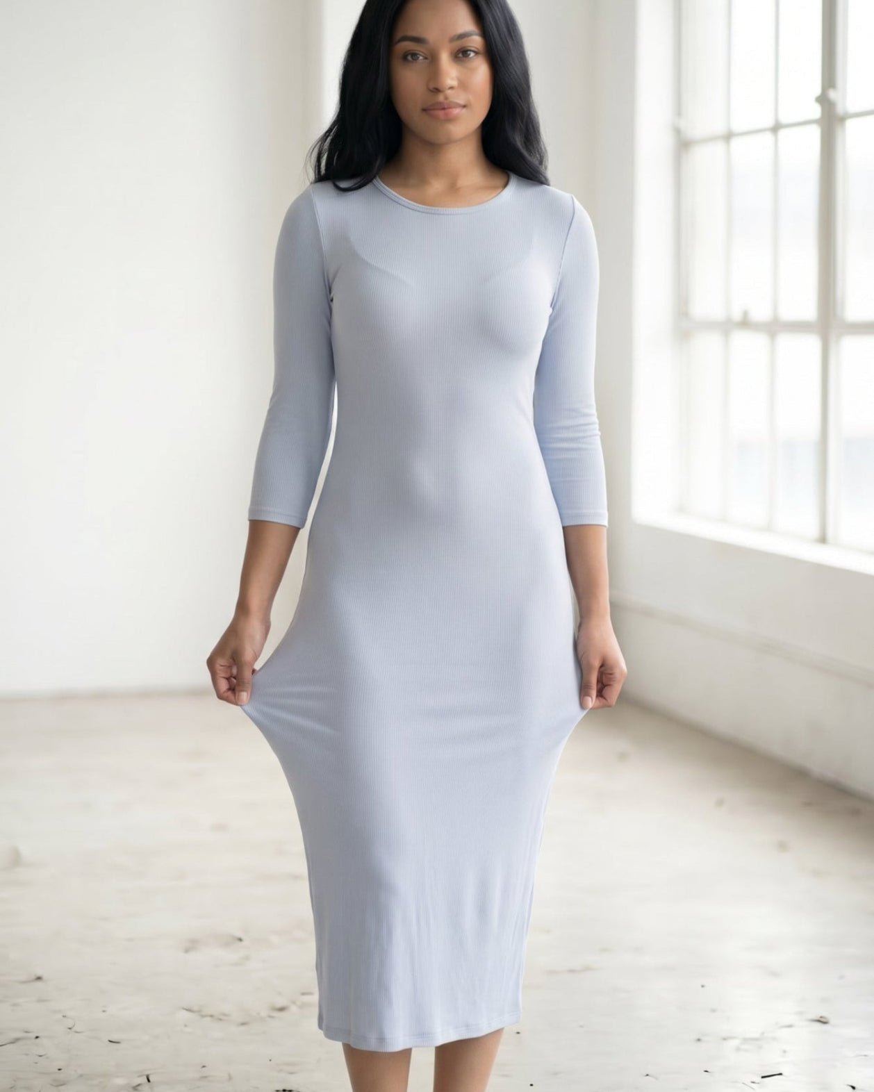 Model wearing Nuggles® Ribbed Midi Layering Dress in Soft Blue