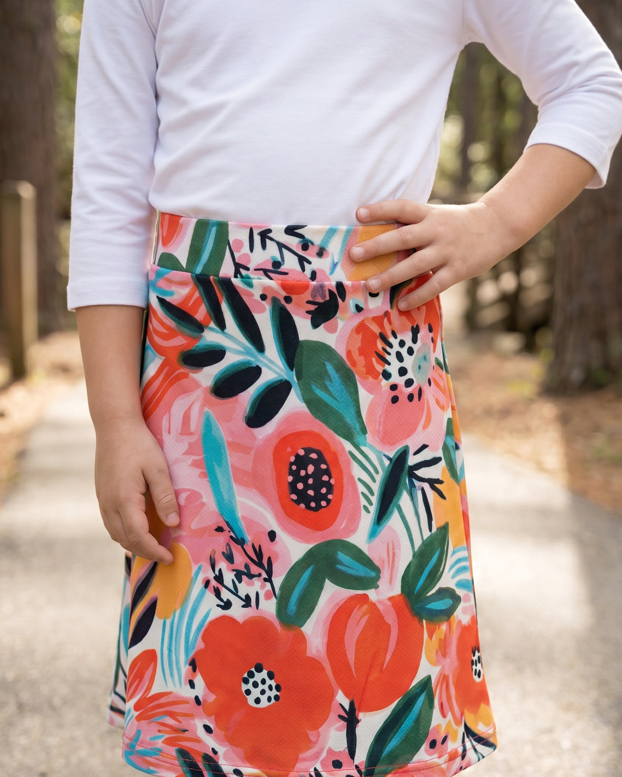 Model wearing Nuggles® Girls All-Sport Skirt in Summer Tropic
