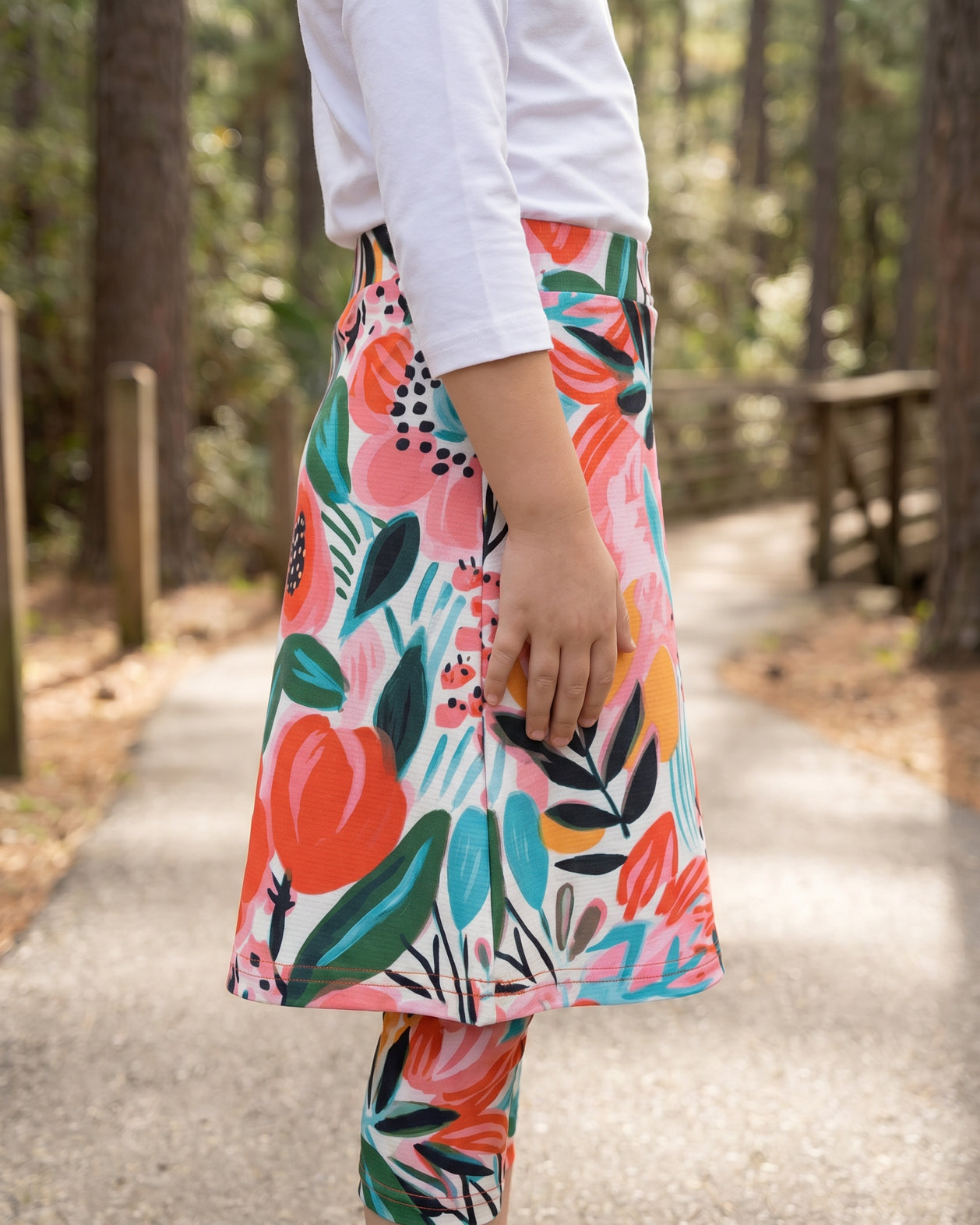 Model wearing Nuggles® Girls All-Sport Skirt in Summer Tropic