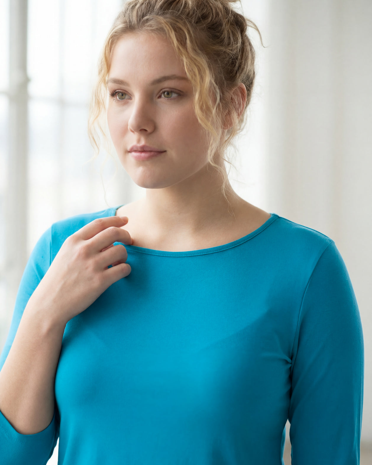 Model wearing the Nuggles® Essential 3/4 Tee in Teal