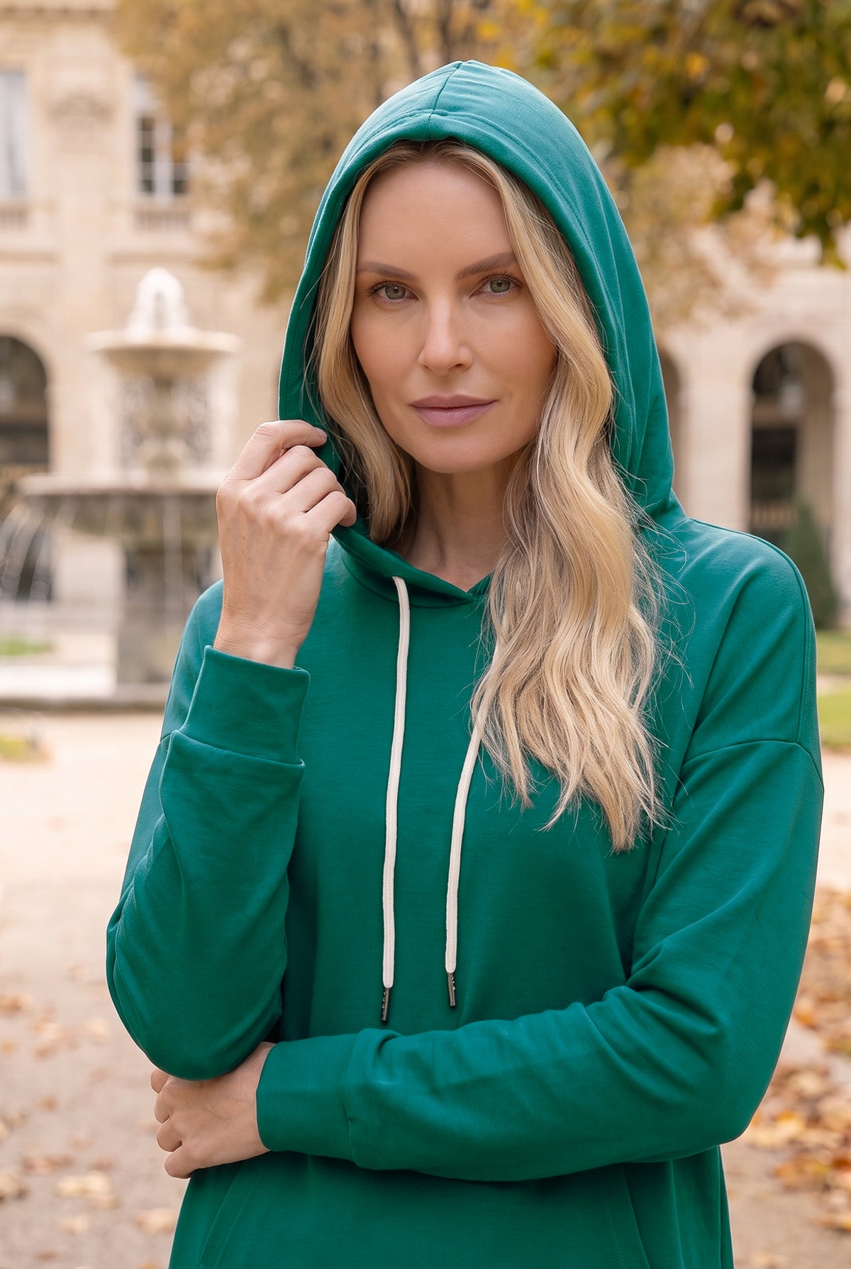 Model wearing Nuggles® Hoodie Dress in Teal Green