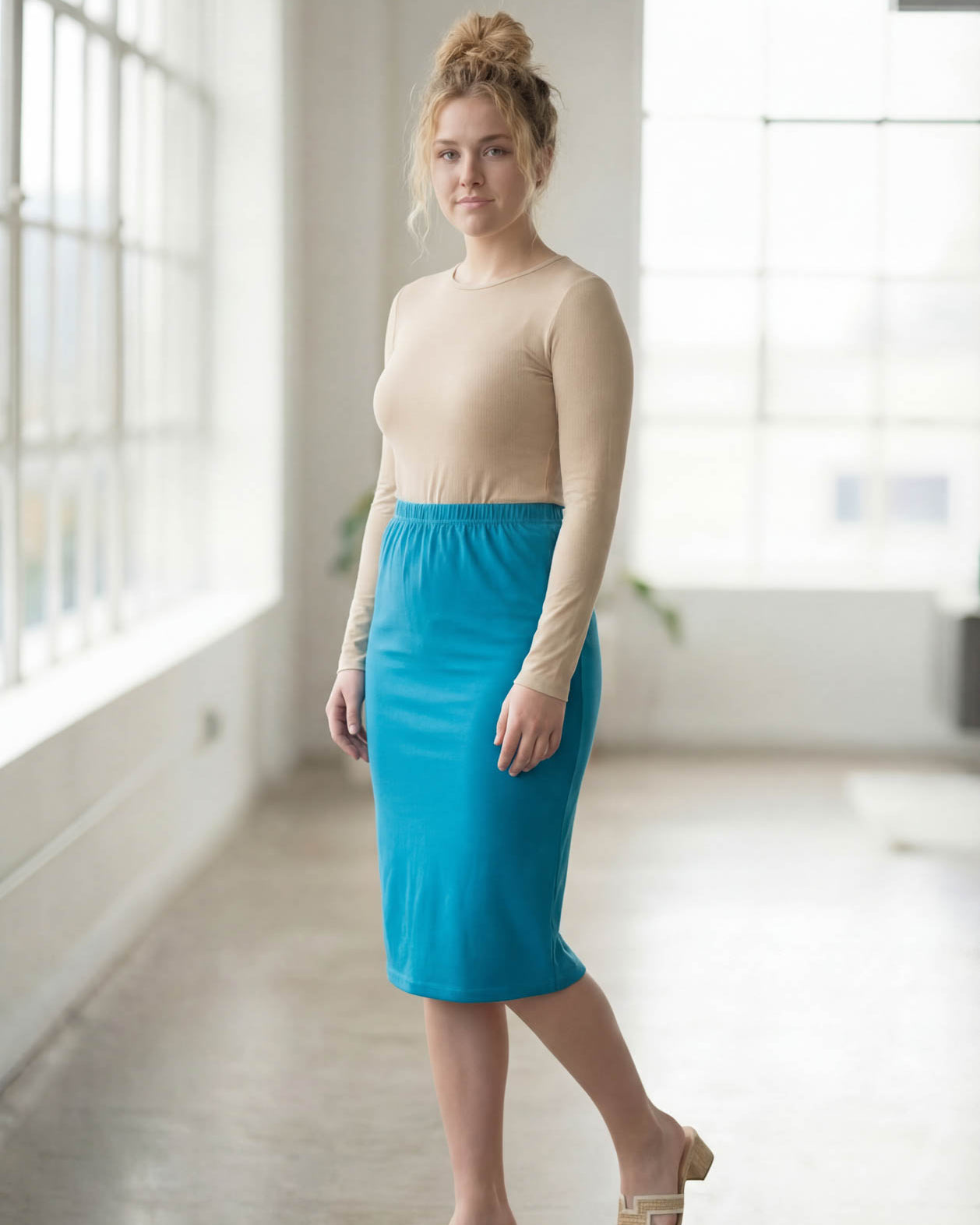 Model wearing Nuggles® 27" Classic Skirt in Turquoise