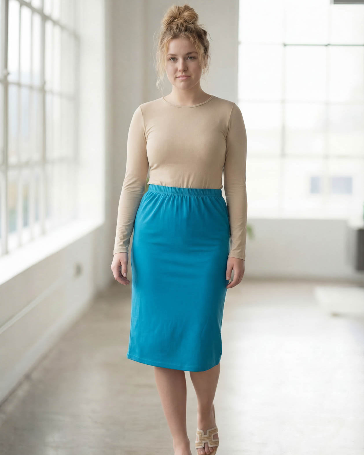 Model wearing Nuggles® 27" Classic Skirt in Turquoise