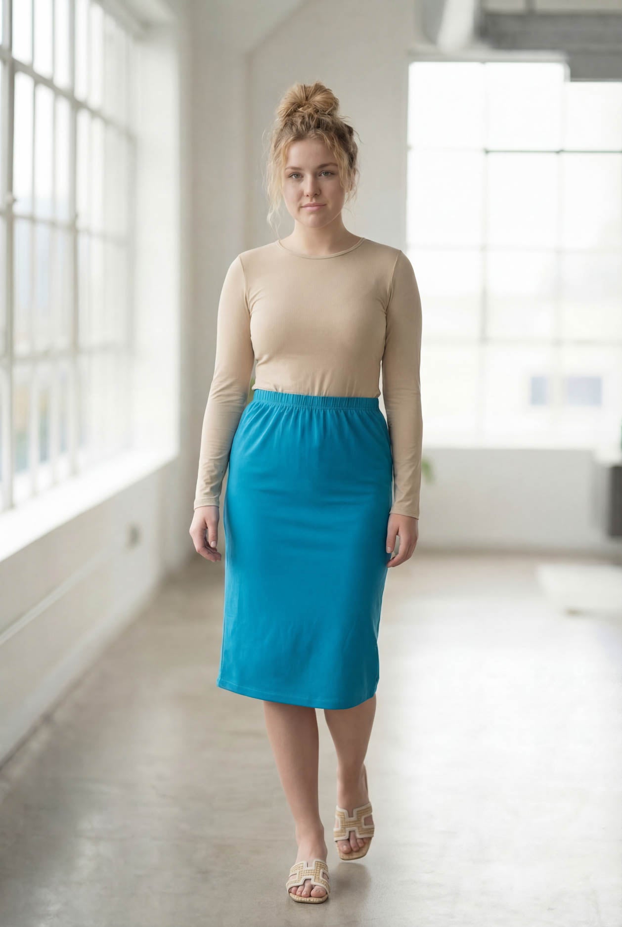 Model wearing Nuggles® 27" Classic Skirt in Turquoise