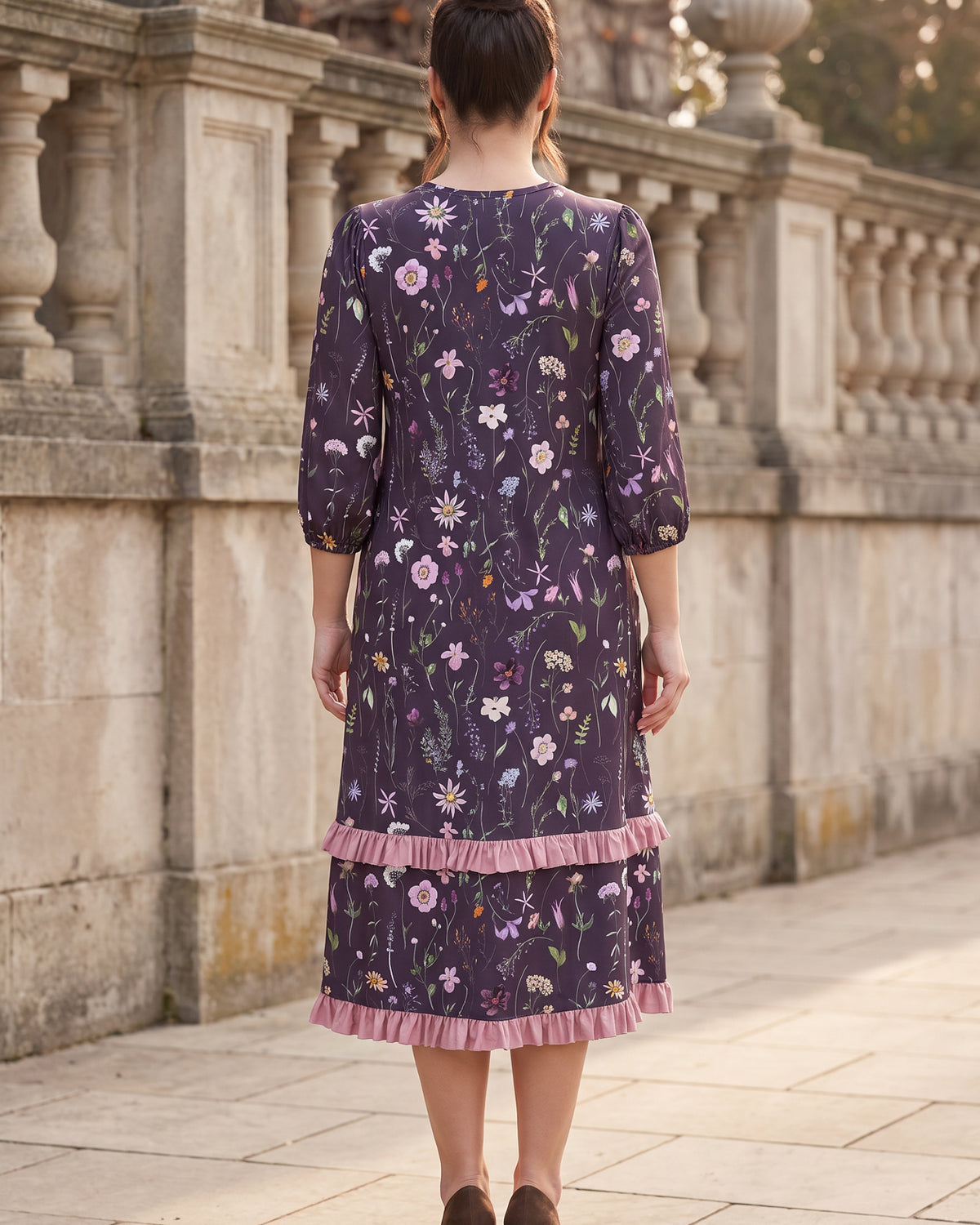 Model wearing Nuggles® Patricia Midi Dress in Twilight Garden