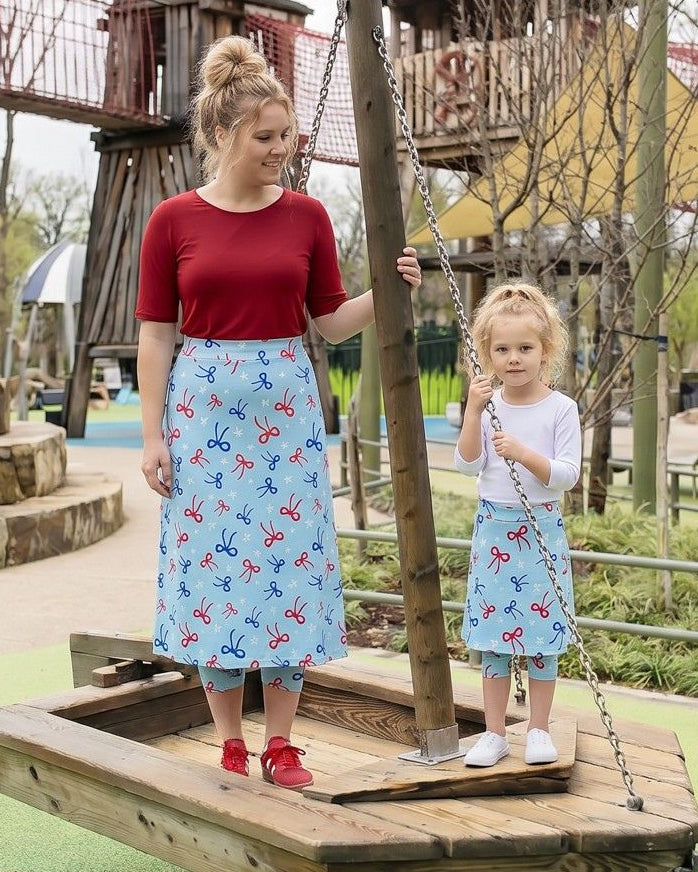 Model wearing Nuggles® Girls All-Sport Skirt in Bow Active