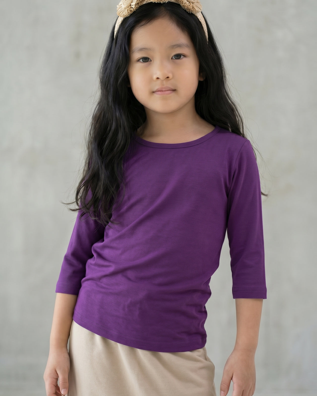 Model wearing the Girls' Nuggles® Essential 3/4 Tee in Violet