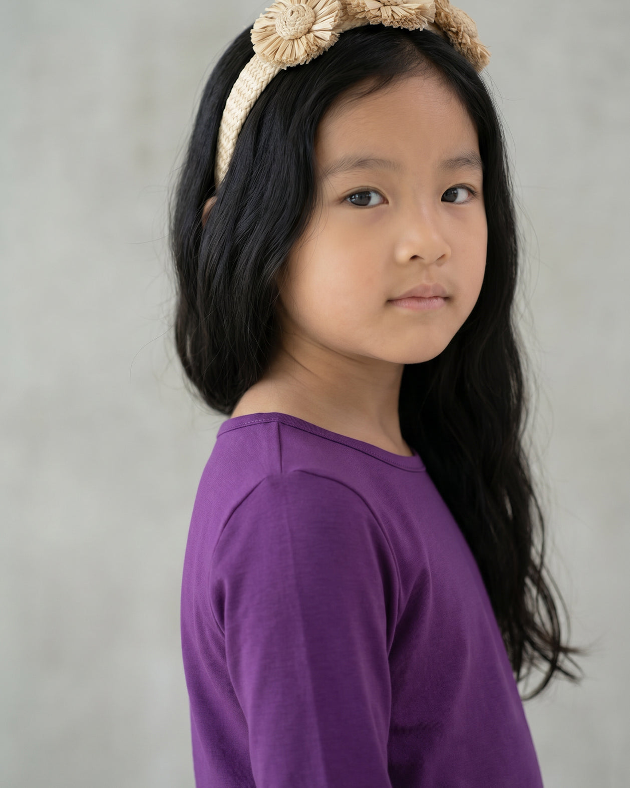Model wearing the Girls' Nuggles® Essential 3/4 Tee in Violet