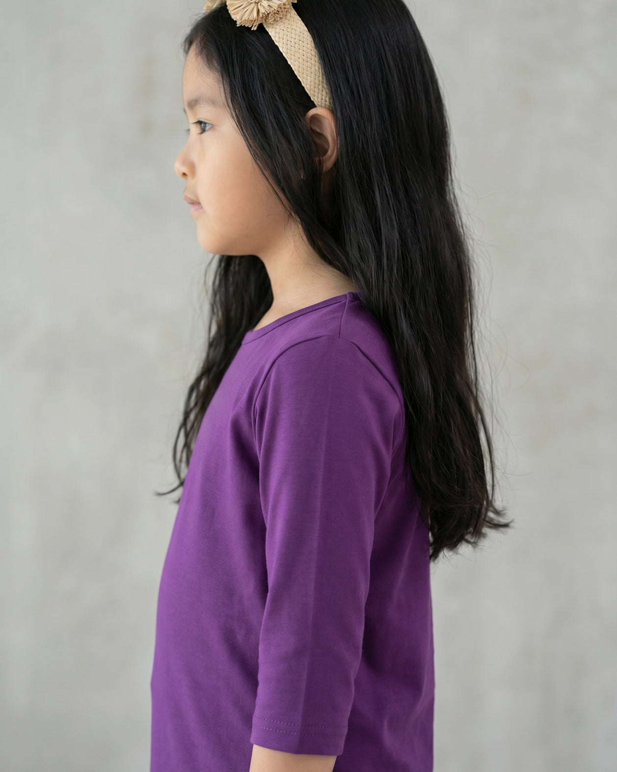 Model wearing the Girls' Nuggles® Essential 3/4 Tee in Violet