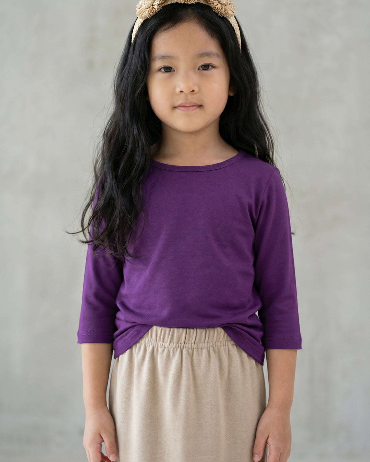 Model wearing the Girls' Nuggles® Essential 3/4 Tee in Violet