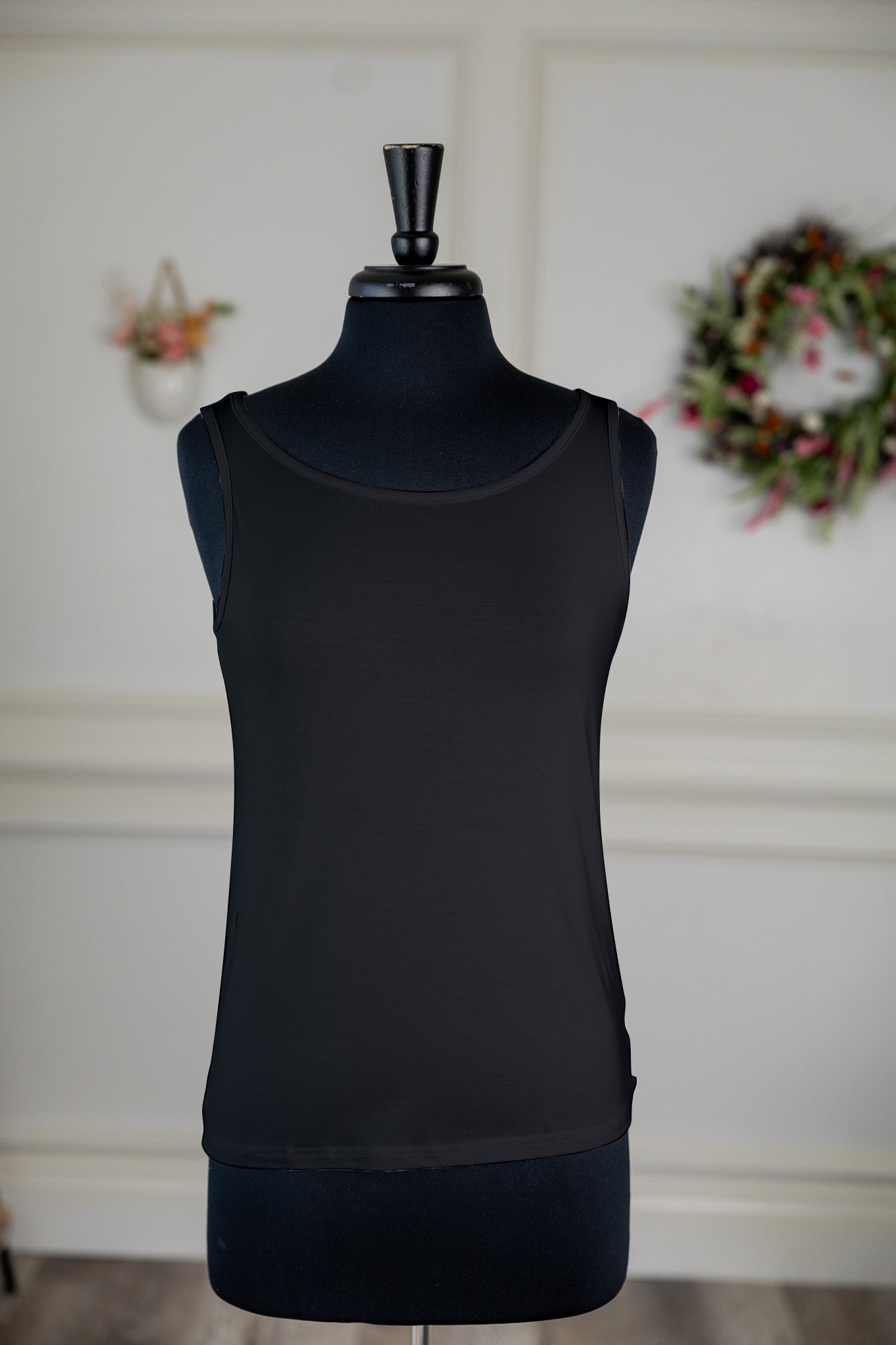 Stock photo of the front of our Nuggles® Essential Wide Neck Tank in Black