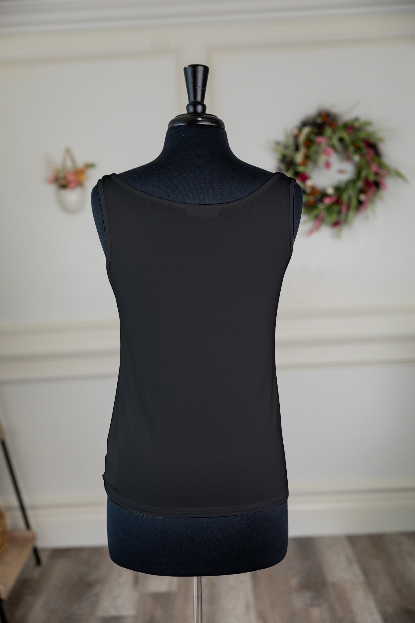 Stock photo of the back of our Nuggles® Essential Wide Neck Tank in Black