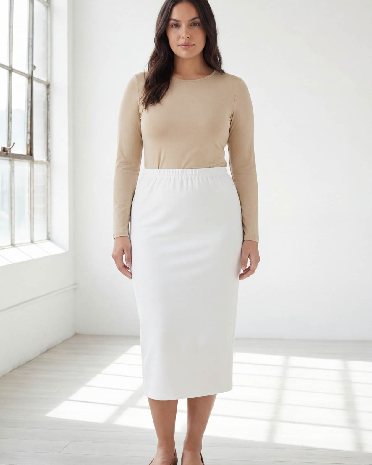 Model wearing Nuggles® 31" Classic Skirt in White
