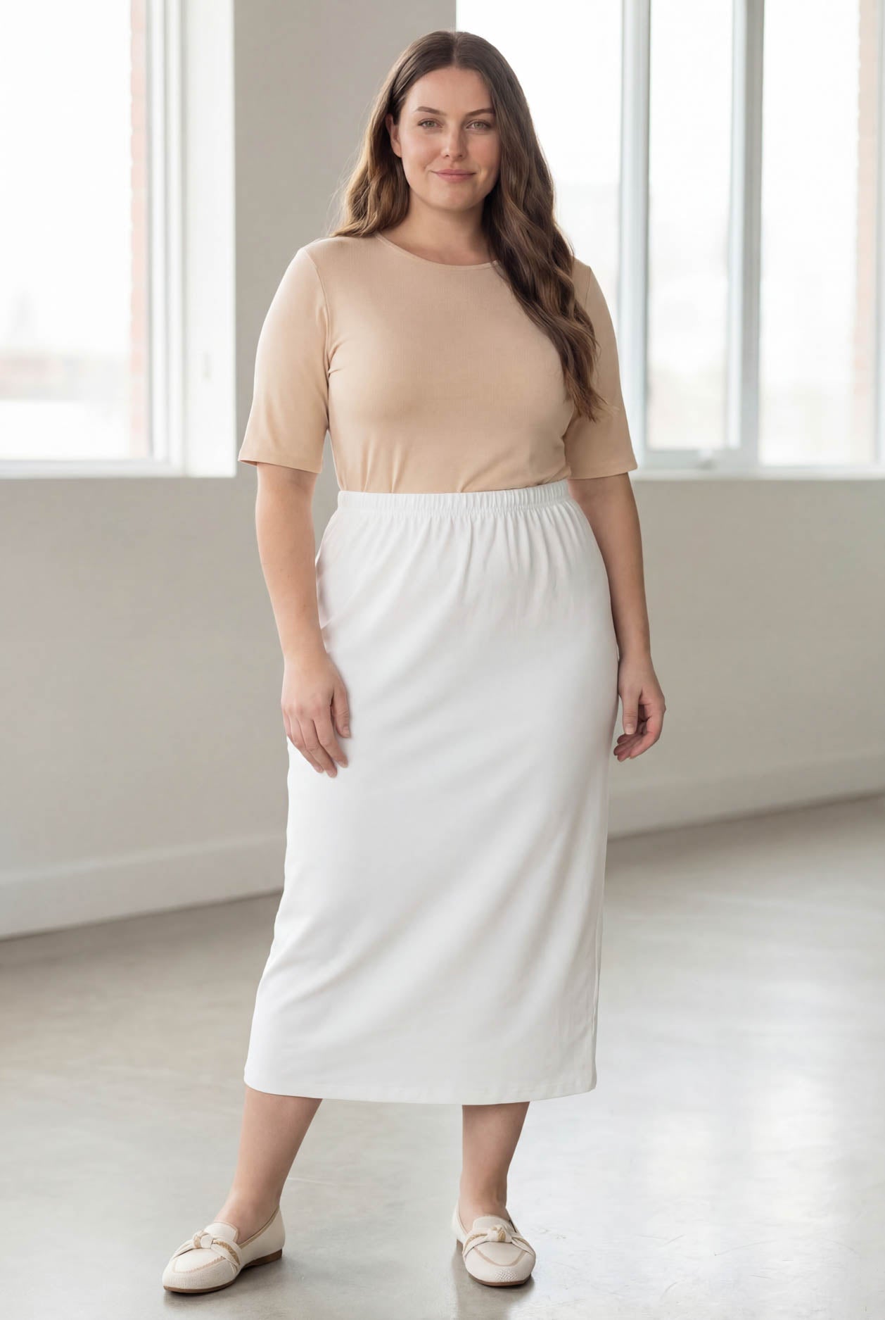 Model wearing Nuggles® 34" Classic Skirt in White