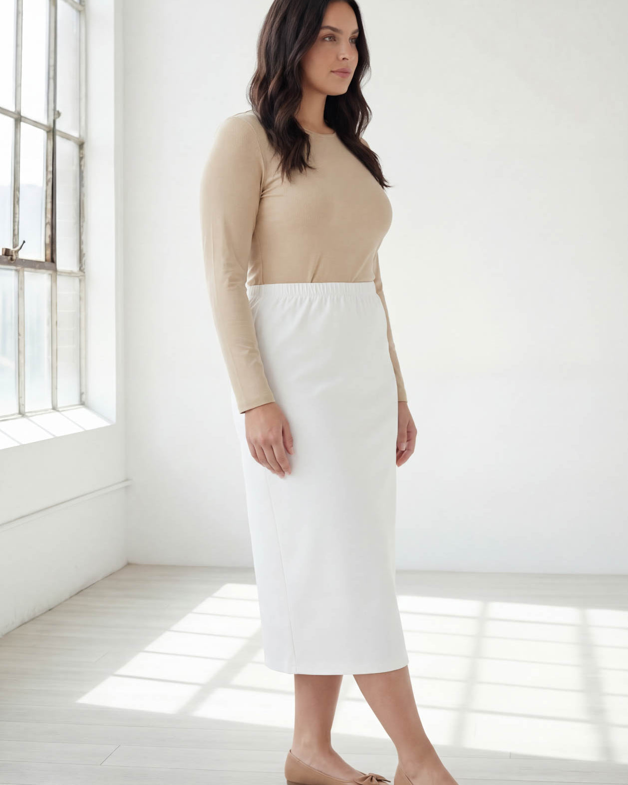 Model wearing Nuggles® 31" Classic Skirt in White