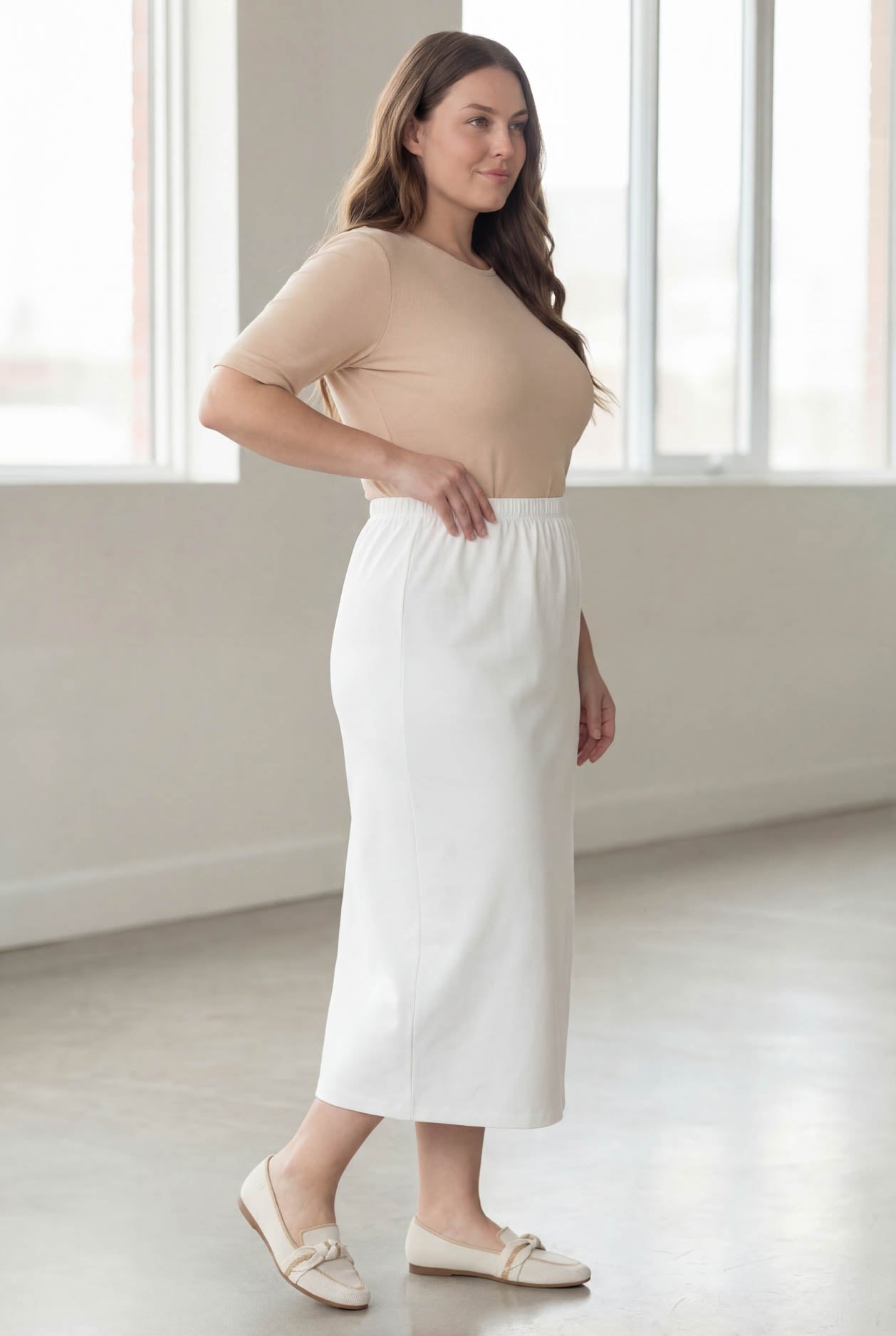 Model wearing Nuggles® 34" Classic Skirt in White