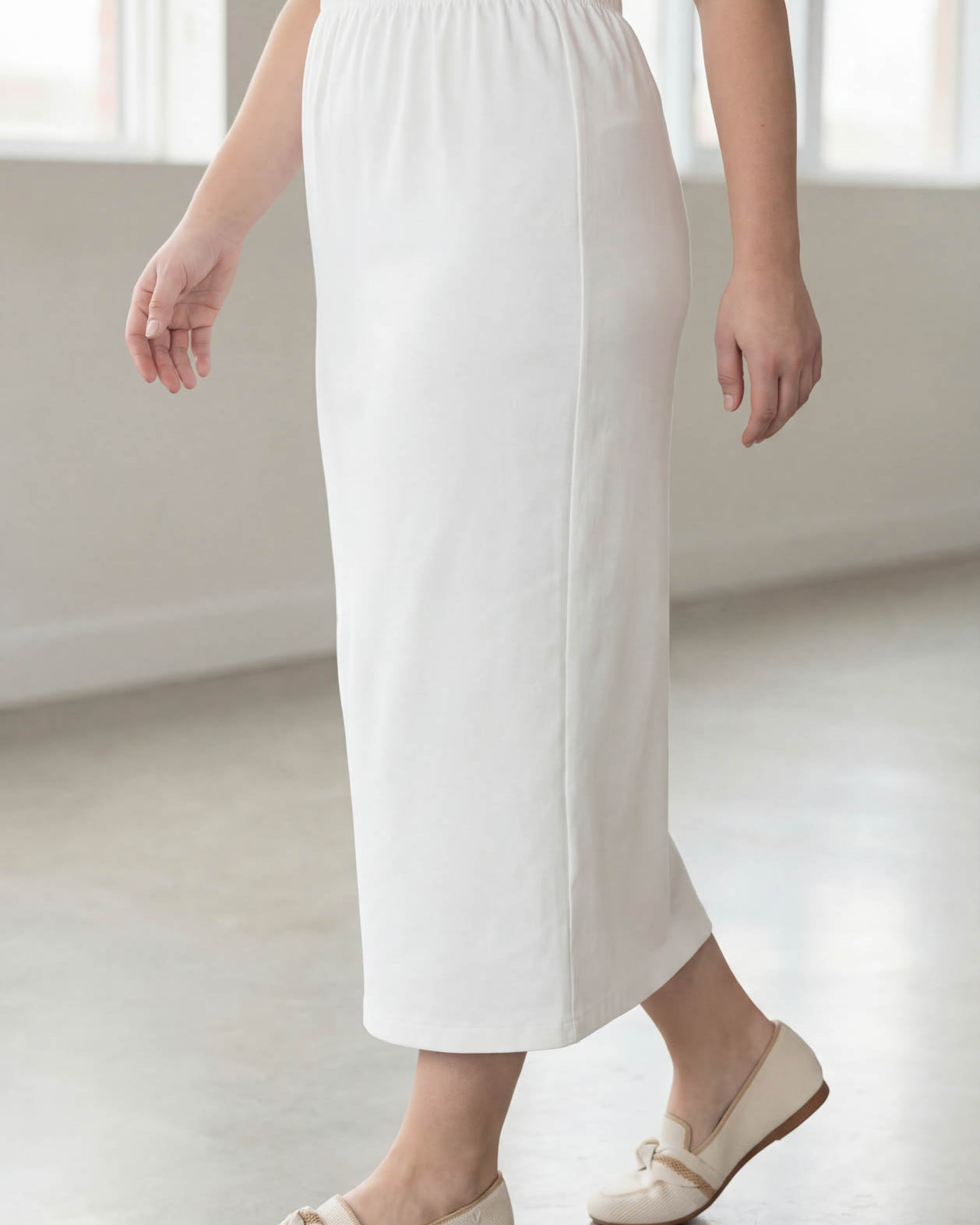Model wearing Nuggles® 34" Classic Skirt in White