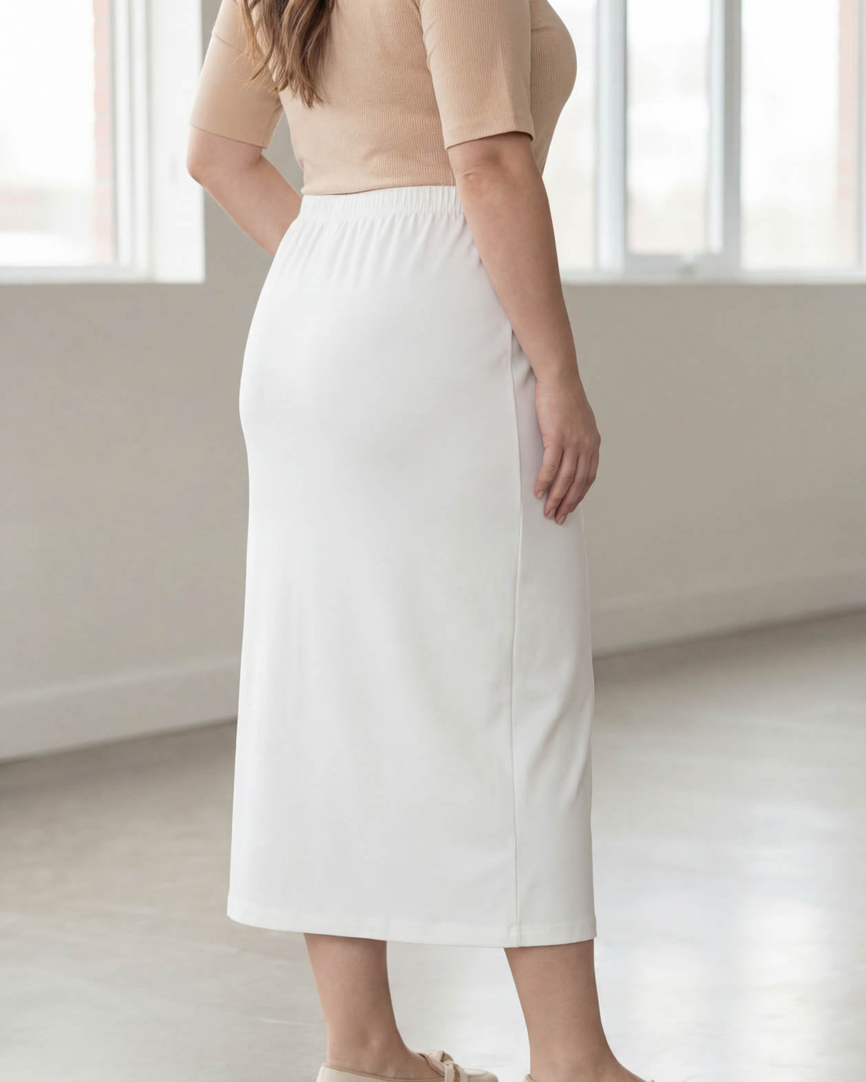 Model wearing Nuggles® 34" Classic Skirt in White