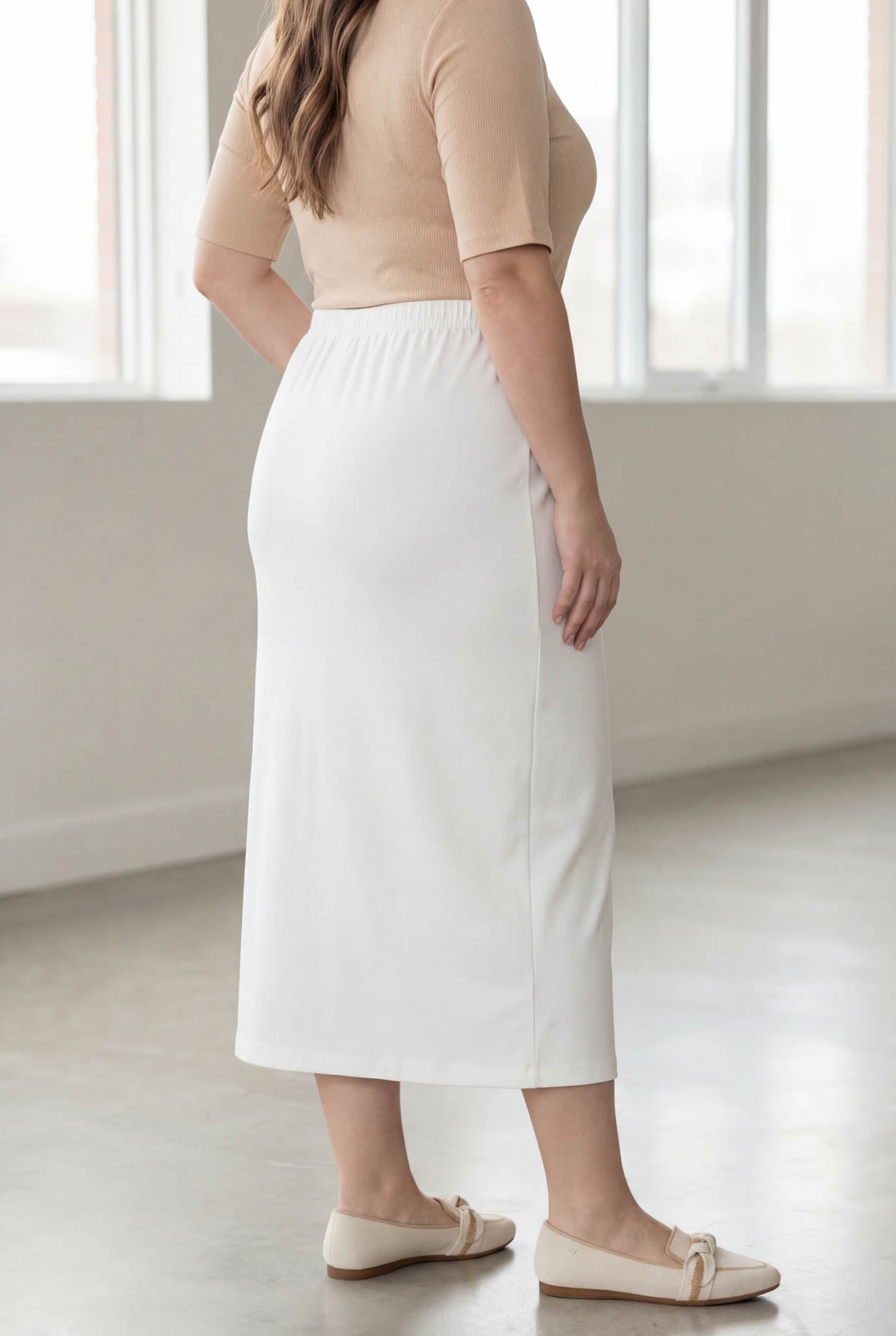 Model wearing Nuggles® 34" Classic Skirt in White