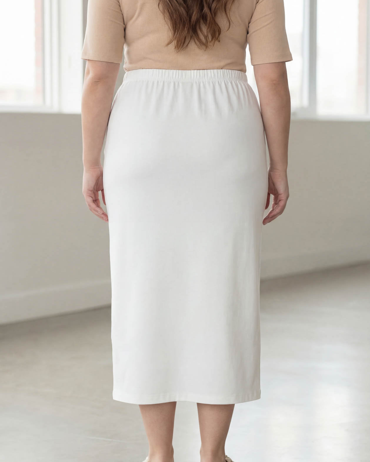 Model wearing Nuggles® 34" Classic Skirt in White