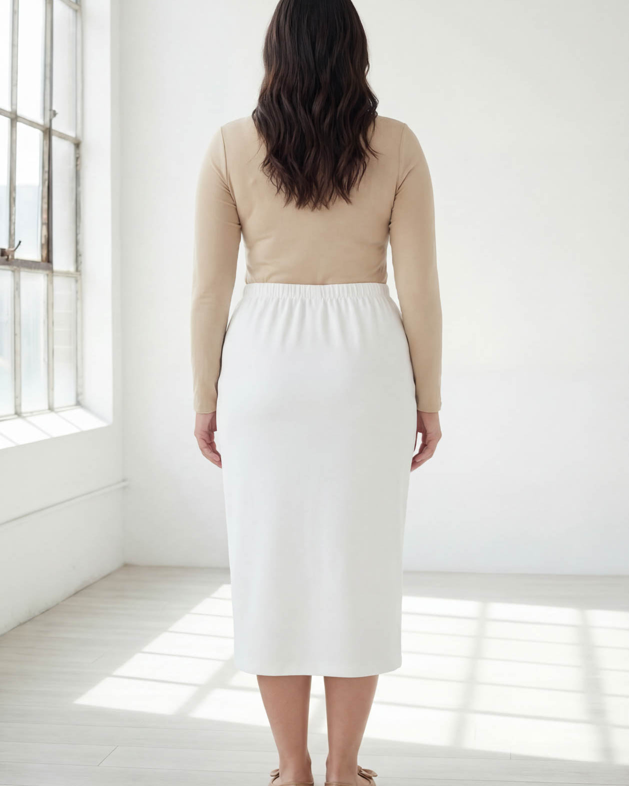Model wearing Nuggles® 31" Classic Skirt in White