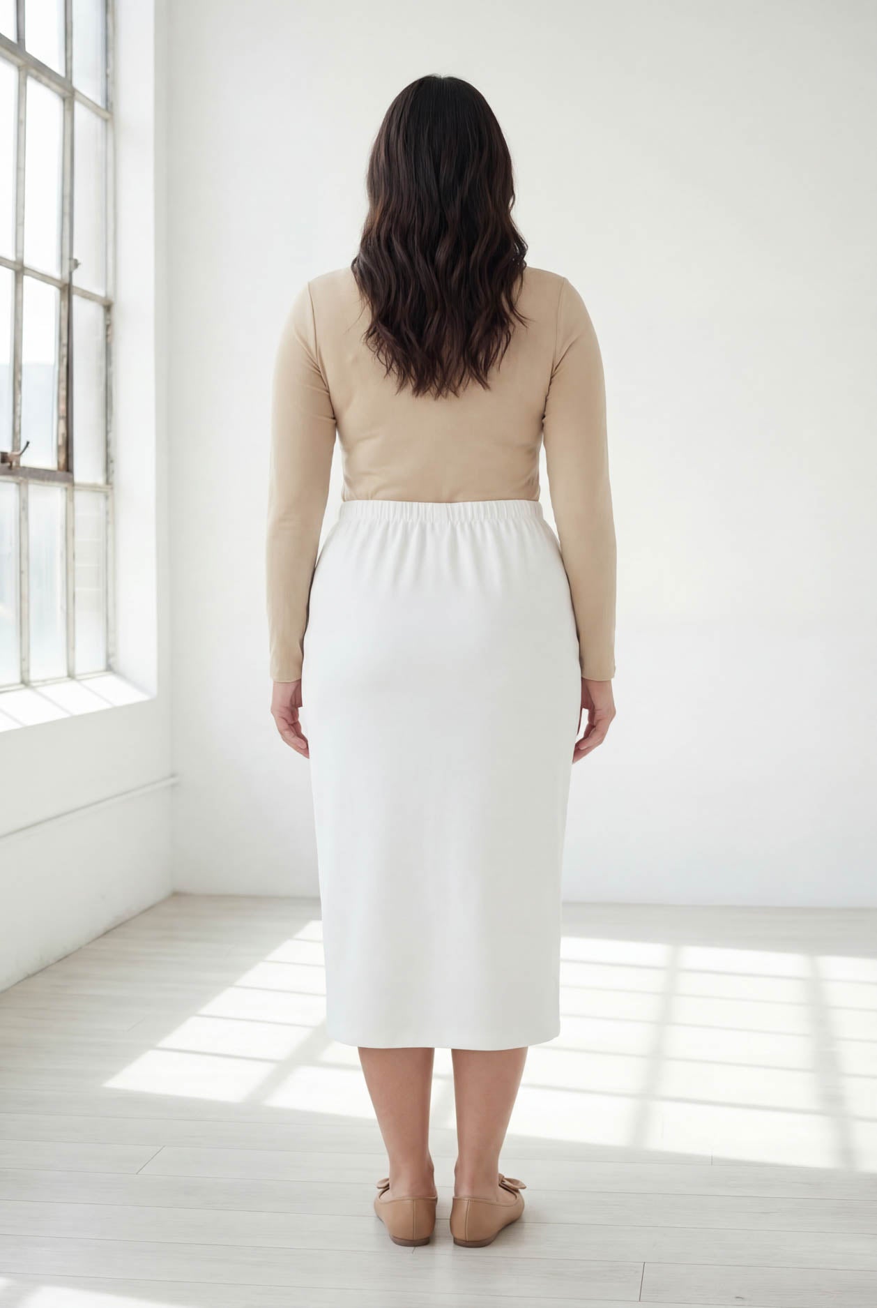 Model wearing Nuggles® 31" Classic Skirt in White