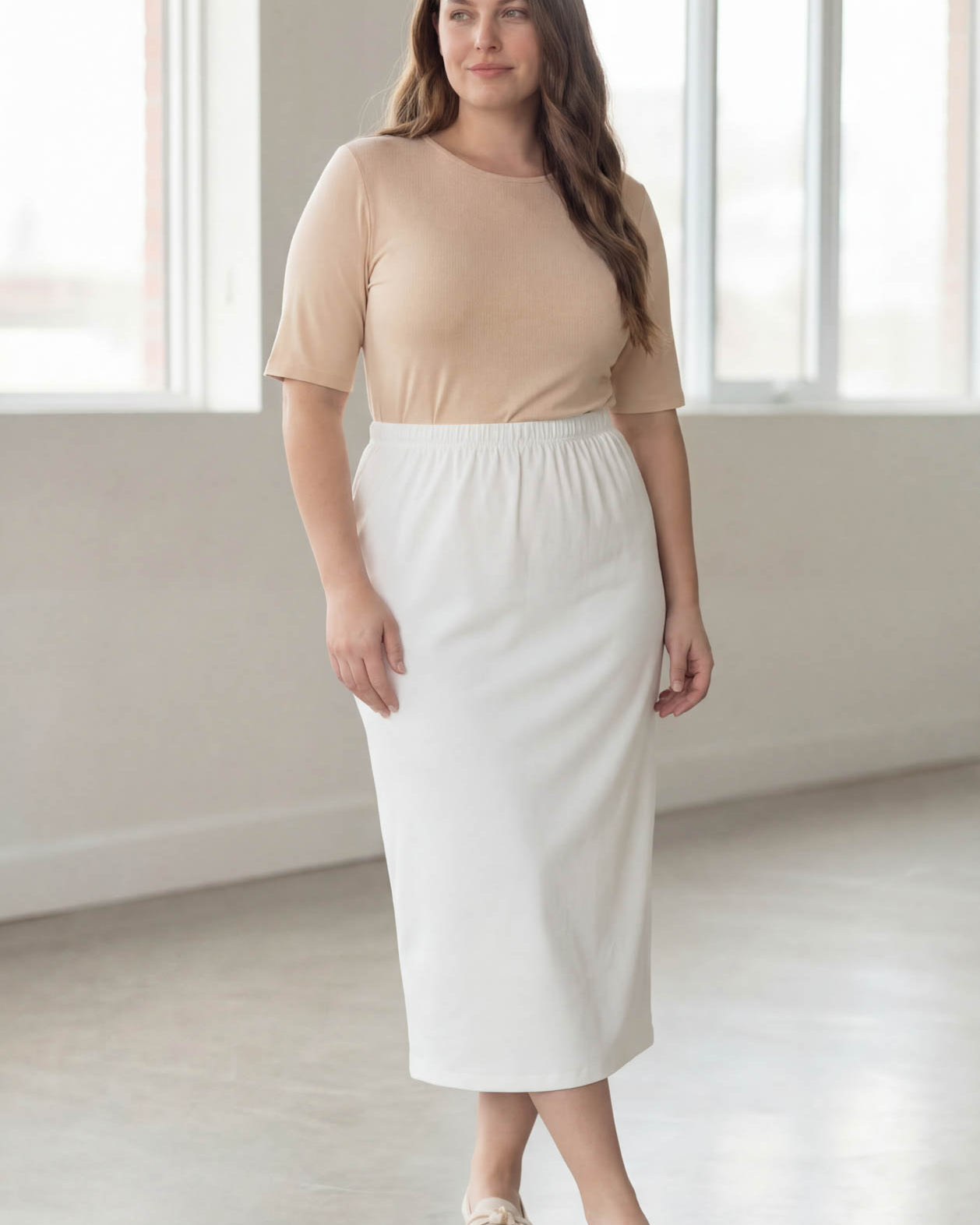 Model wearing Nuggles® 34" Classic Skirt in White
