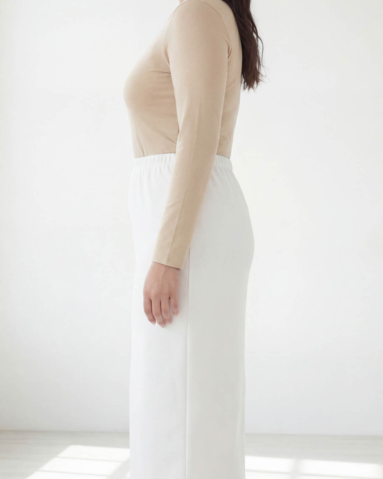 Model wearing Nuggles® 31" Classic Skirt in White