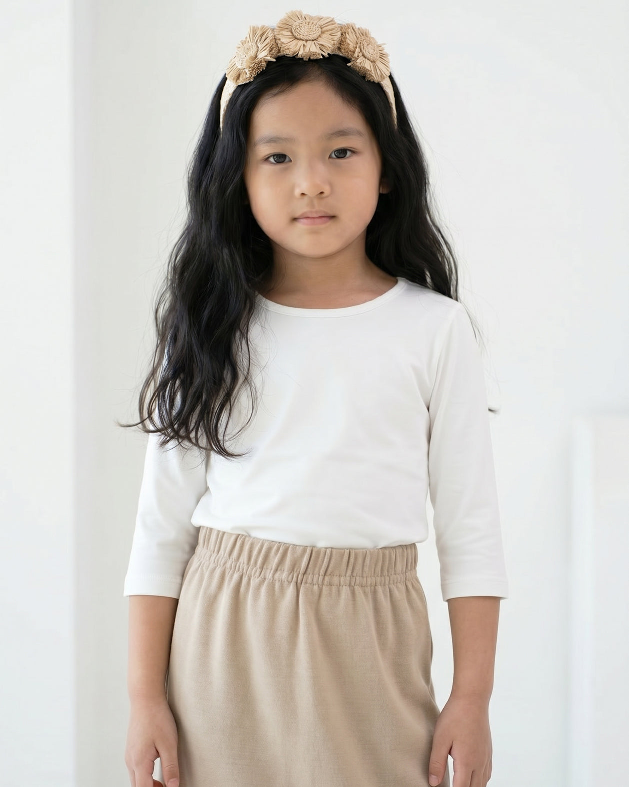 Model wearing the Girls' Nuggles® Essential 3/4 Tee in White