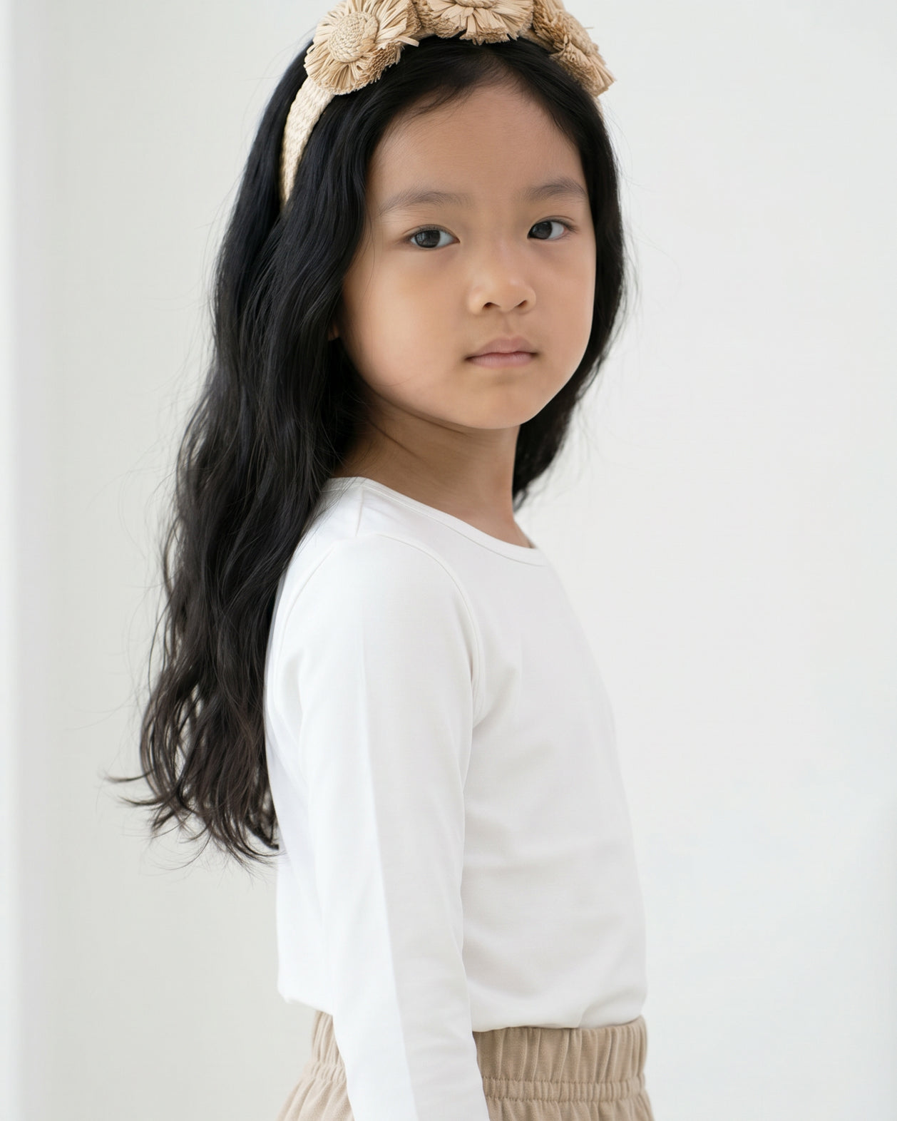 Model wearing the Girls' Nuggles® Essential 3/4 Tee in White