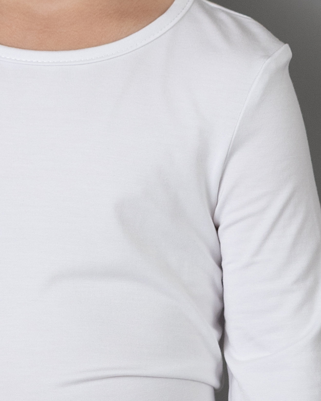 Model wearing the Girls' Nuggles® Essential 3/4 Tee in White