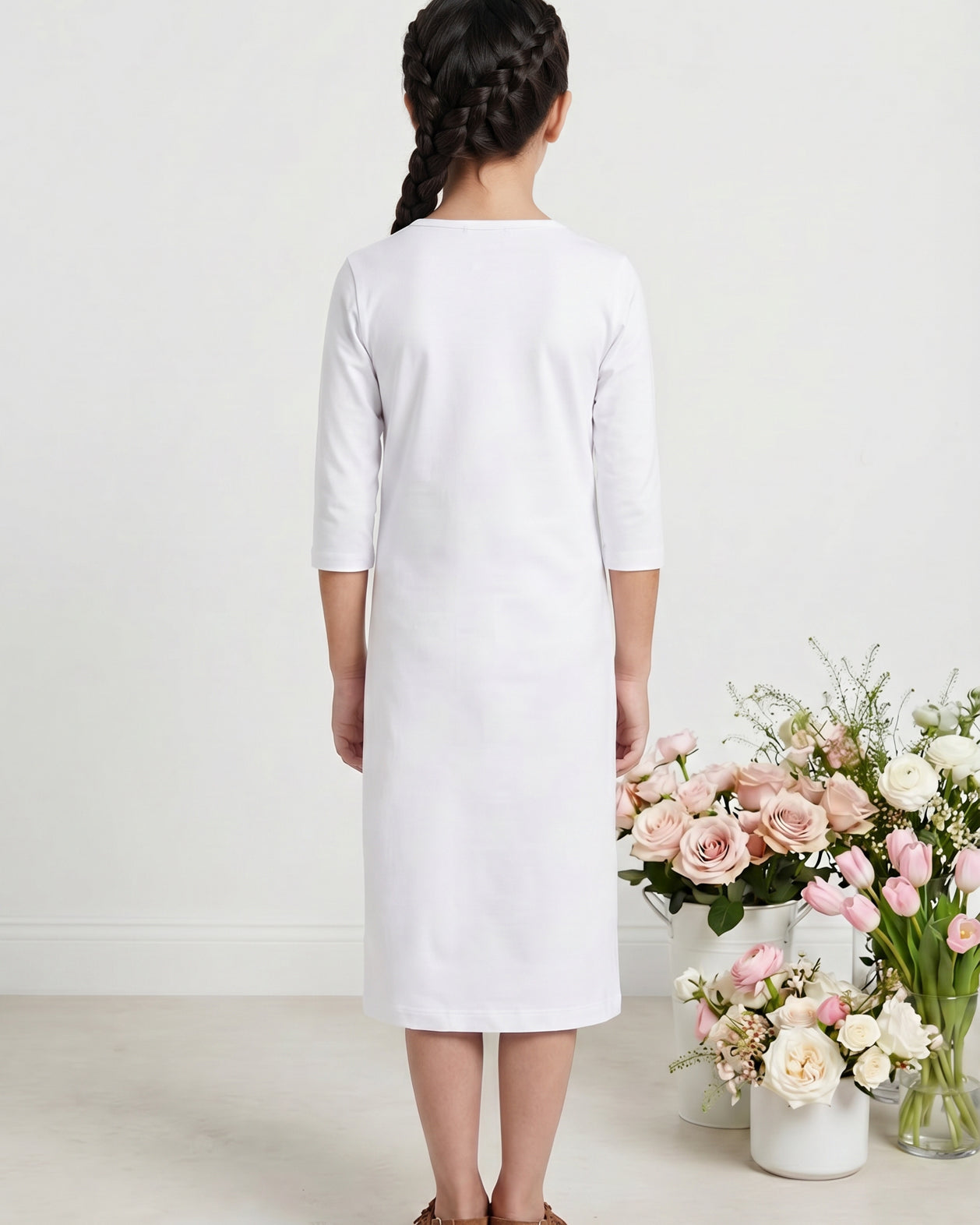Model wearing Nuggles® Girls Midi Layering Dress in White