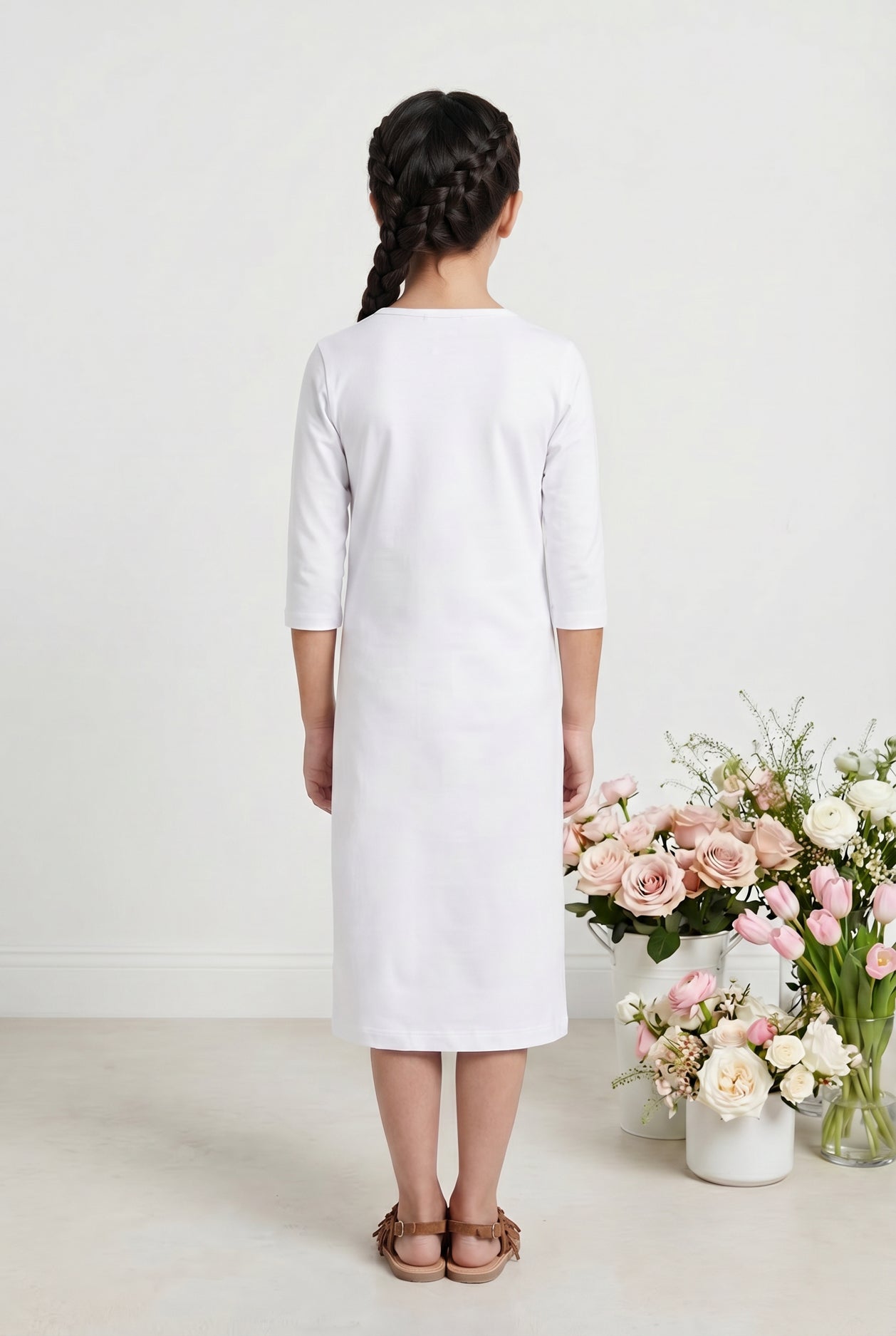 Model wearing Nuggles® Girls Midi Layering Dress in White