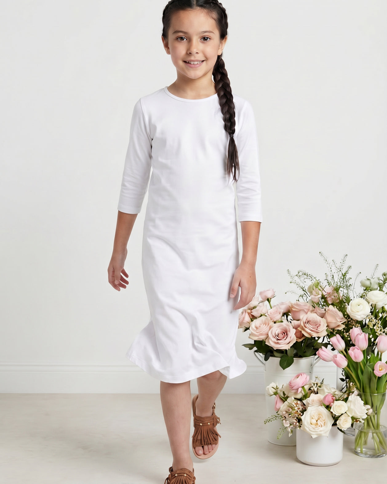 Model wearing Nuggles® Girls Midi Layering Dress in White